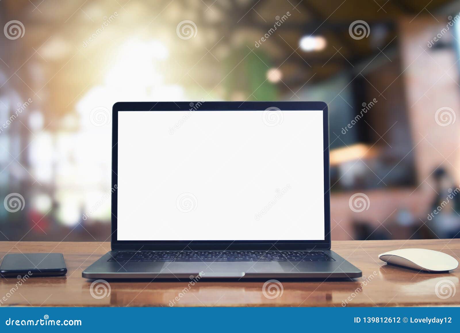 laptop computer blank white screen and mobile on table in cafe