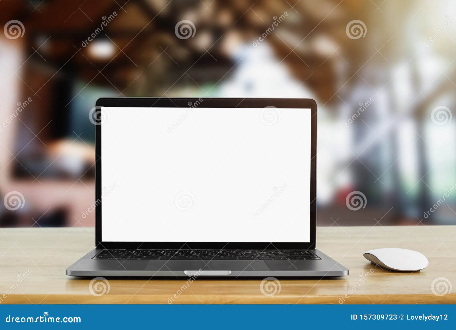 Laptop Computer Blank White Screen on Table in Cafe Background Stock