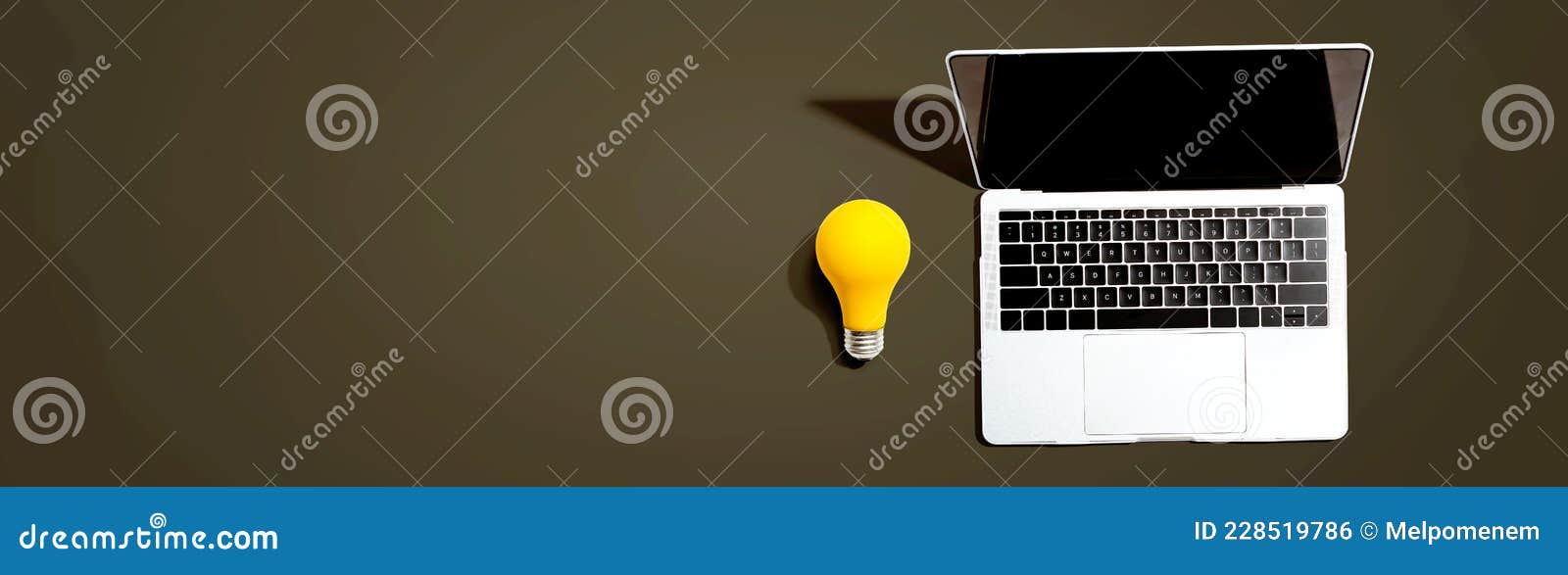 Laptop Computer with a Yellow Light Bulb Stock Photo Image of light, table 228519786