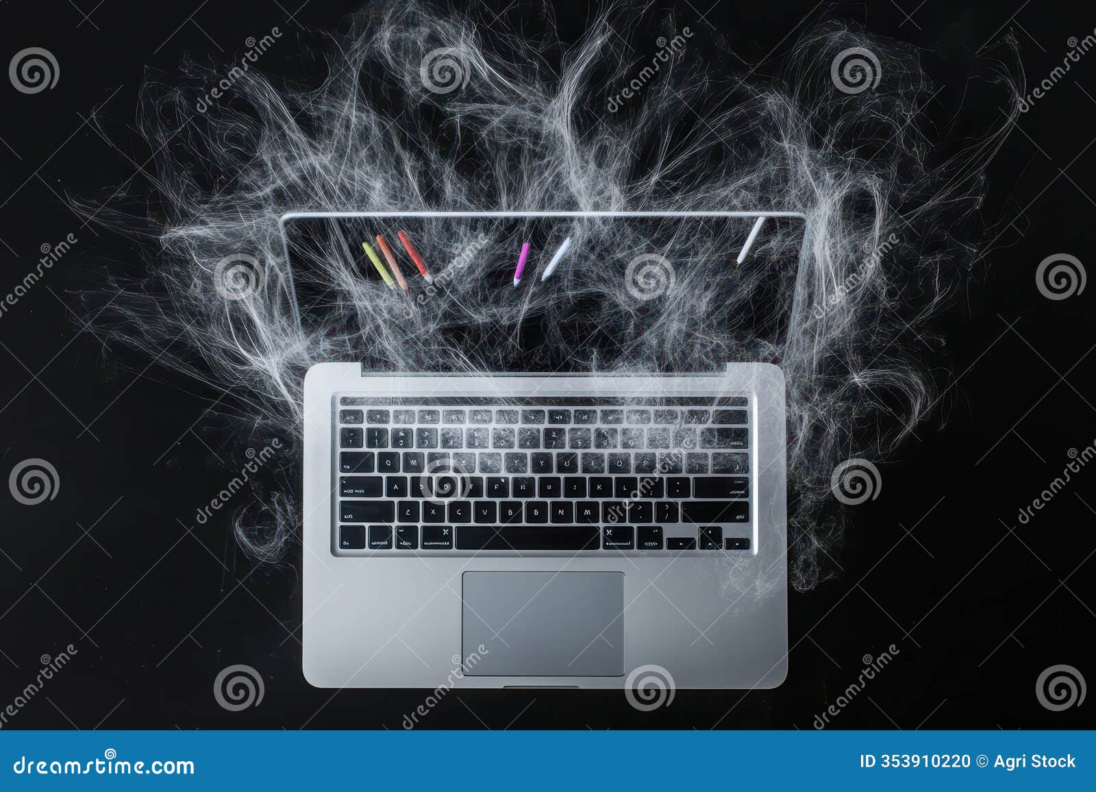 laptop covered in white smoke-like strings