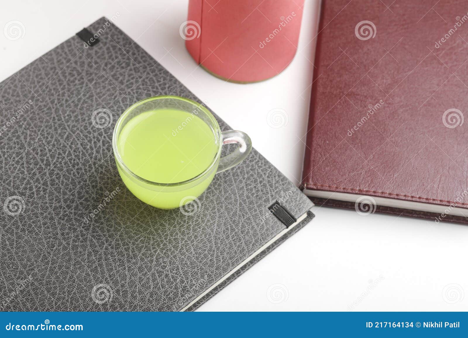 Laptop and Diary with Cup of Green Tea. Work from Home Concept Stock
