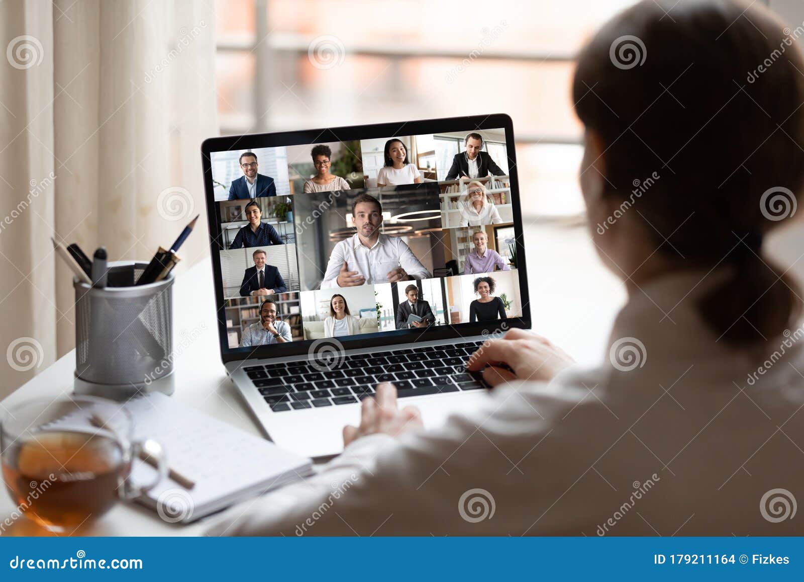 on laptop diverse people collage webcam view over woman shoulder