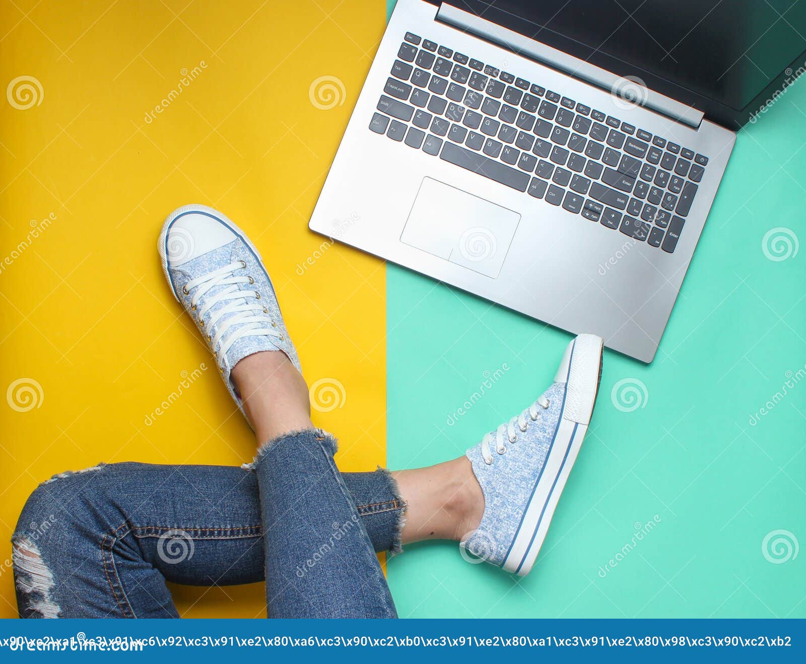 Laptop, Female Legs in Jeans and Sneakers on a Colored Pastel ...