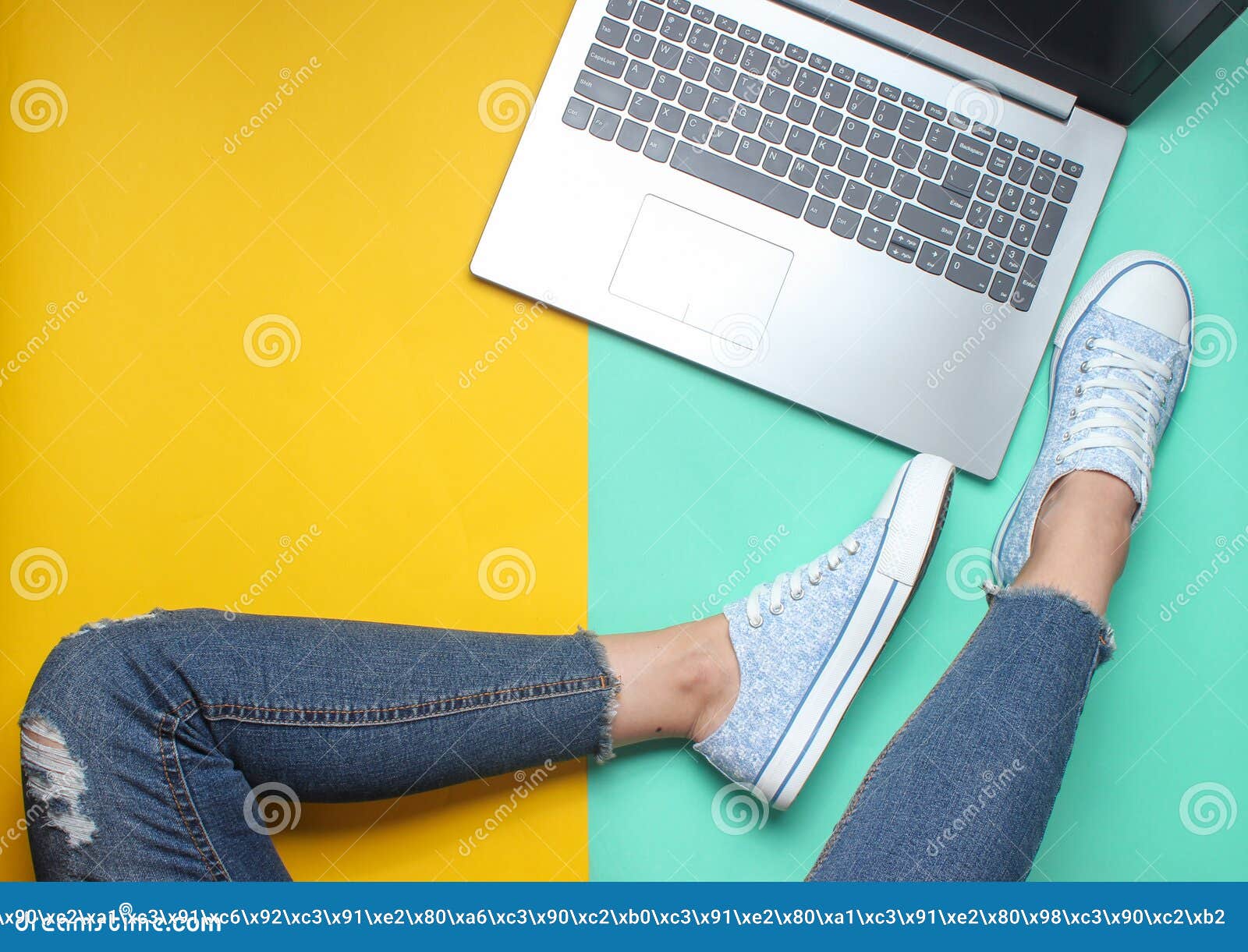 Laptop, Female Legs in Jeans and Sneakers on a Colored Pastel ...