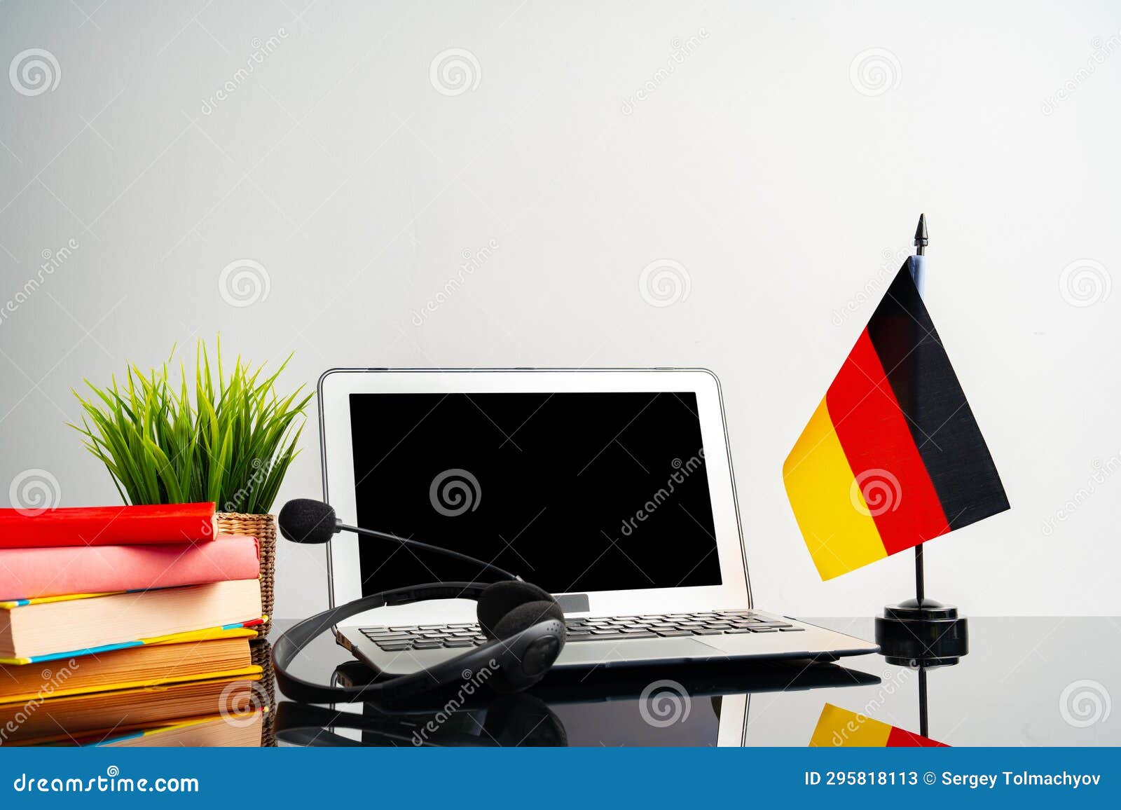 Laptop with German Flag on Working Table, Educational Concept Stock