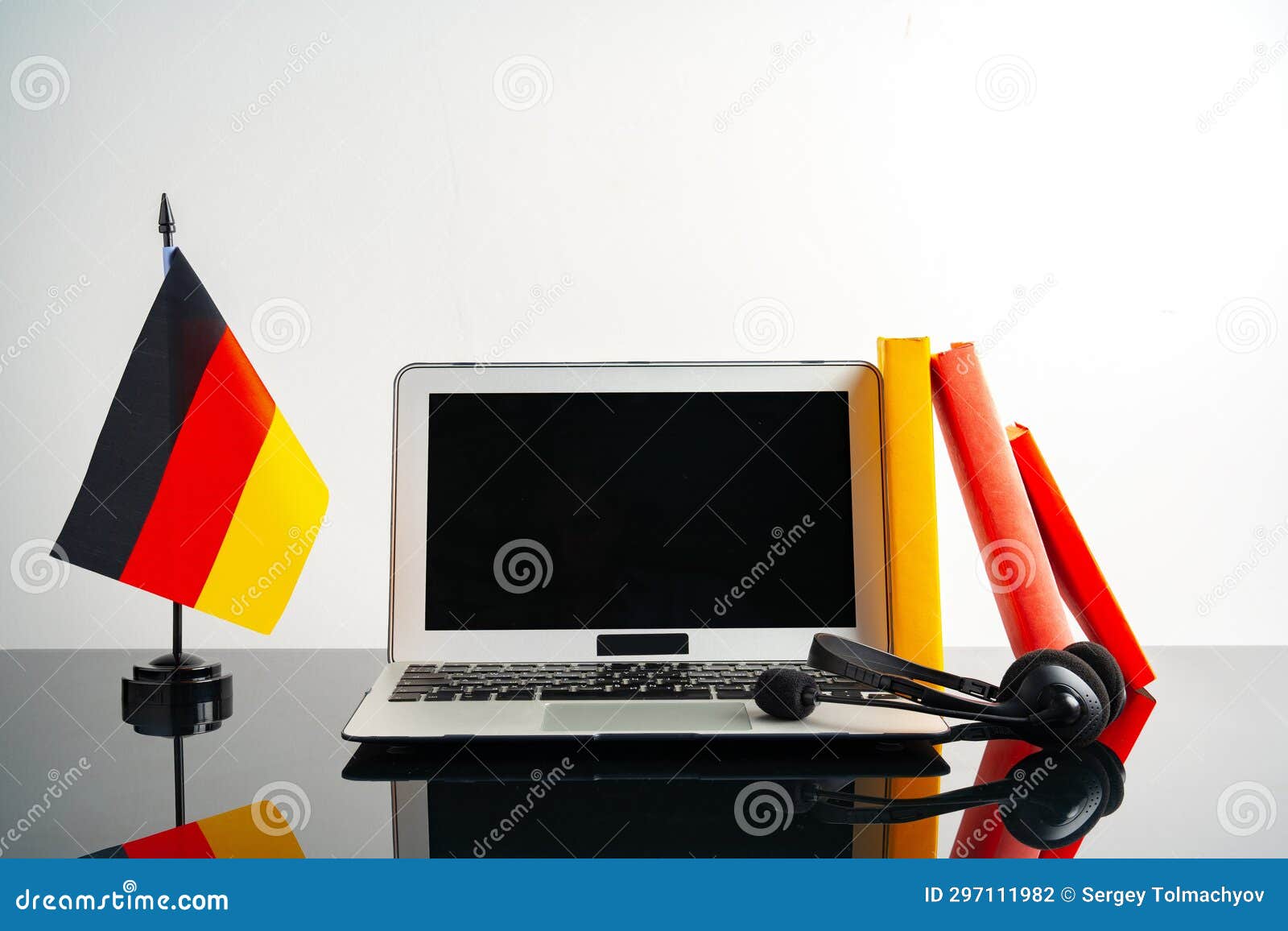 Laptop with German Flag on Working Table, Educational Concept Stock