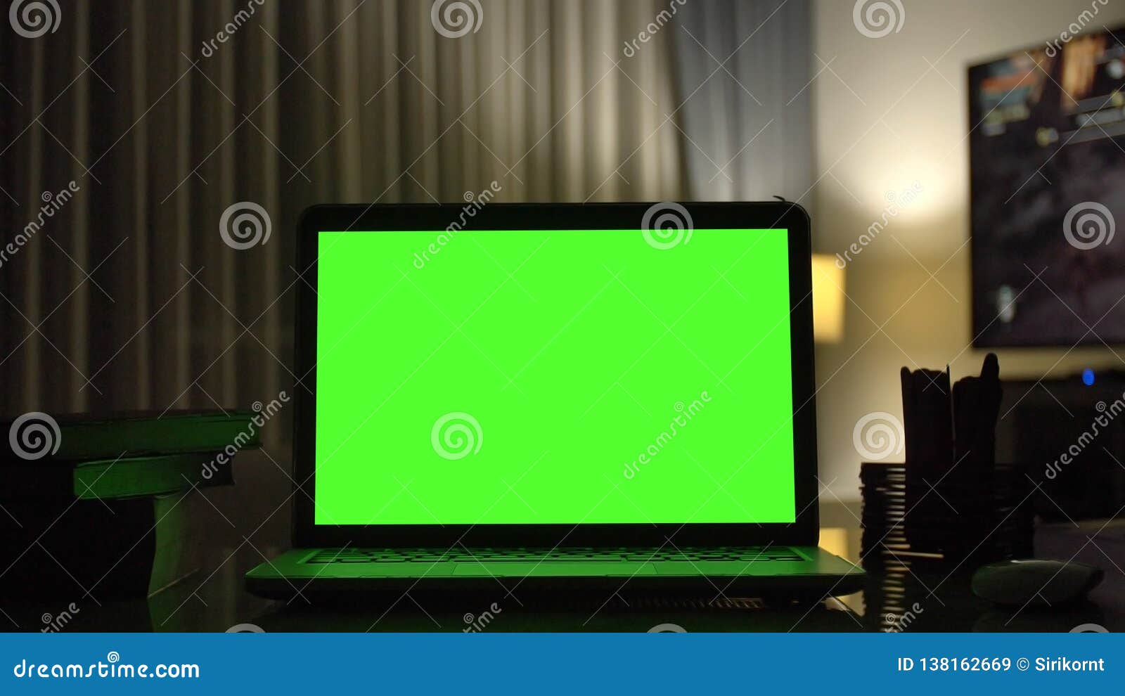 Laptop With Green Screen For Replacement With Blur Background Stock