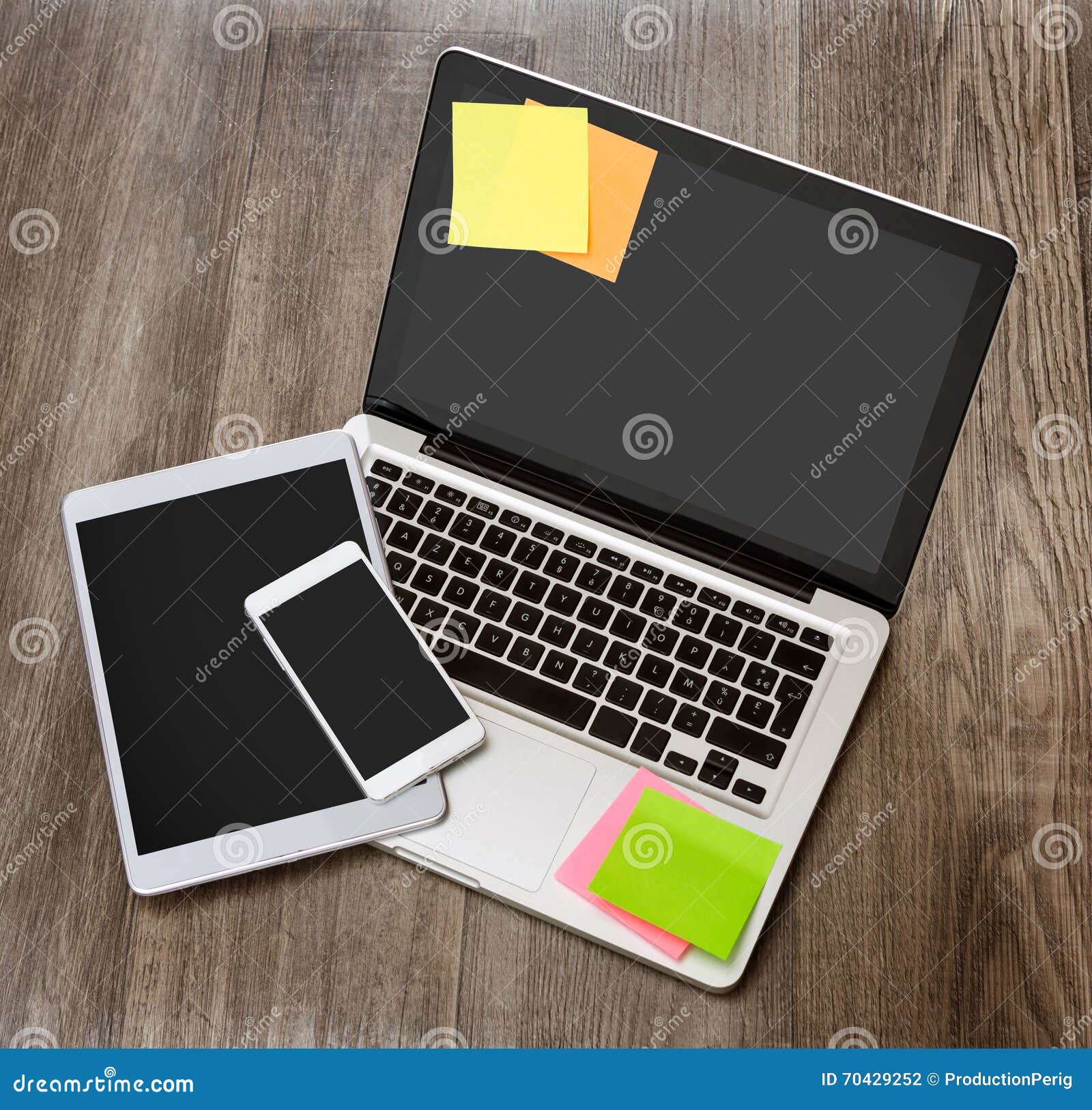 Laptop in High Definition with Tablet and Mobile Phone on a Wood Stock