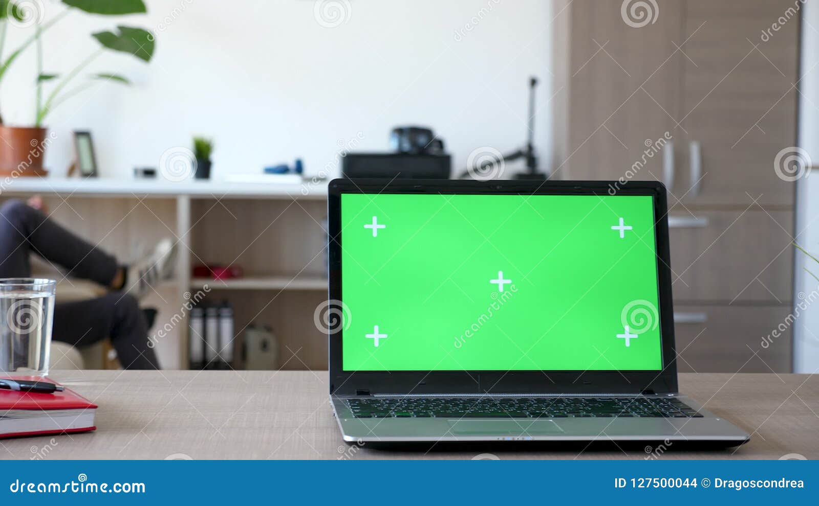 Laptop With Isolated Mock Up Green Screen On A Desk In The Living