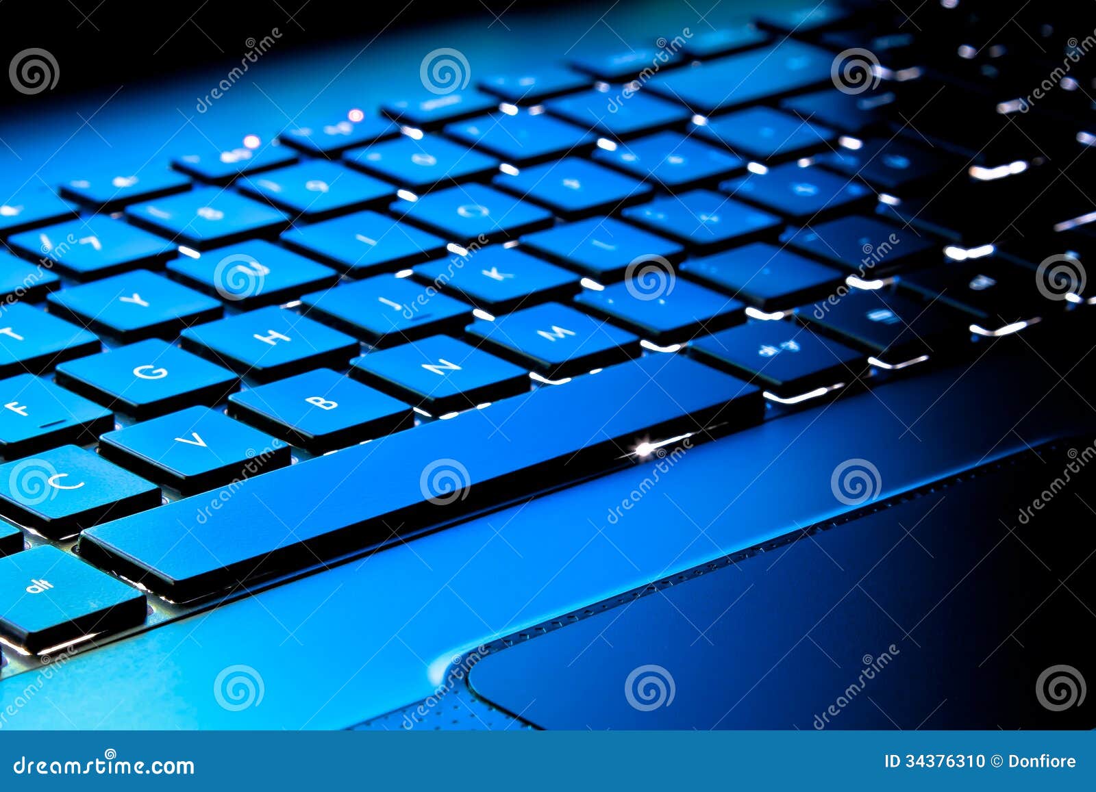 Laptop Keyboard As A Background Toned To Blue Stock Photo Image