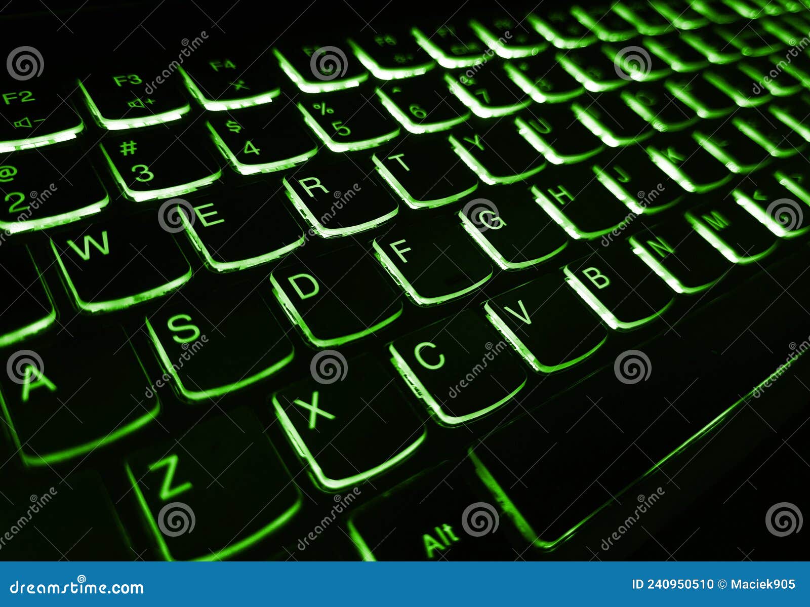 Laptop Keyboard is Glowing in the Dark. Bright Multicolor Macro