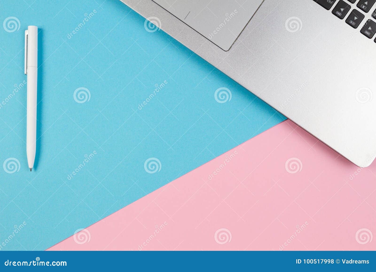 Top View of Laptop Notebook on Blue and Pink Color Background Stock