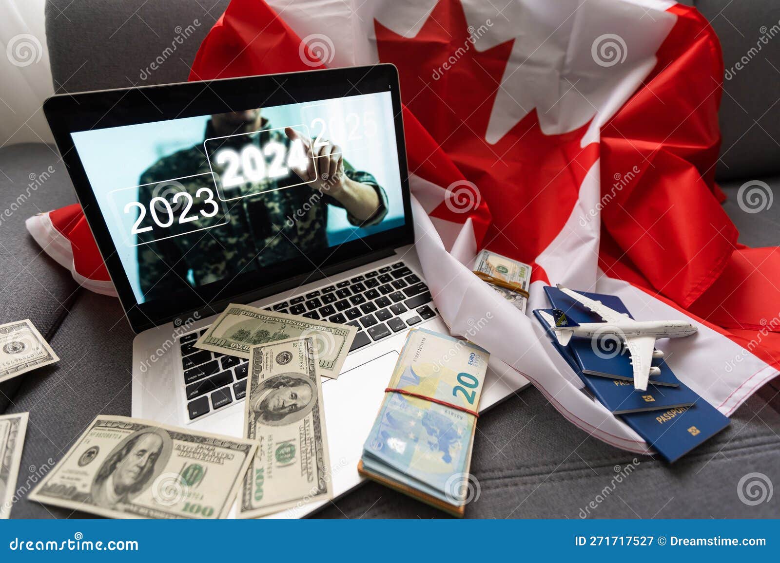 Laptop with Plane, Money and Canada Flag. Stock Illustration