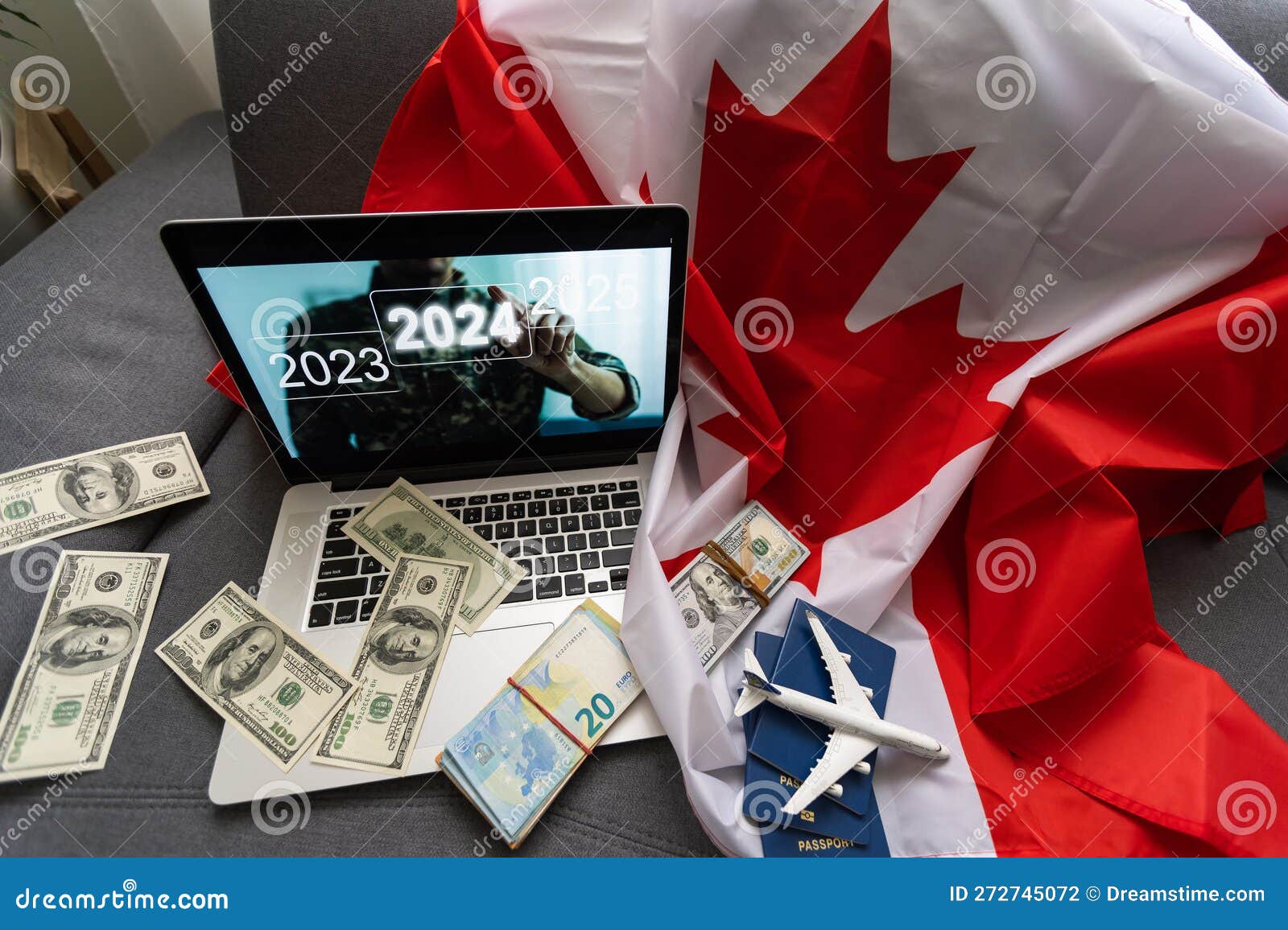 Laptop with Plane, Money and Canada Flag. Stock Photo Image of badge