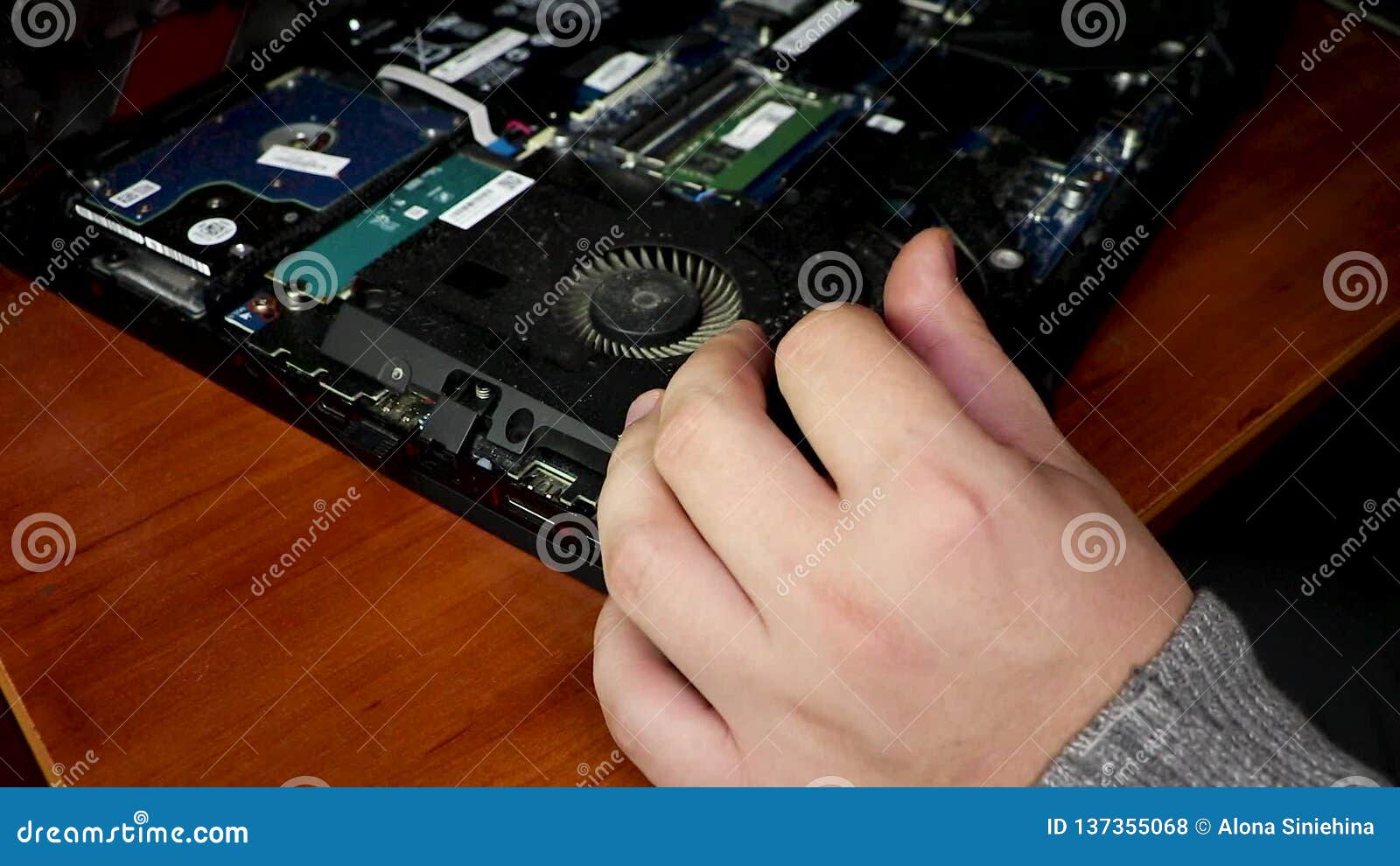 Laptop, Removed the Back Cover, Visible Chips and the Hand of a Master