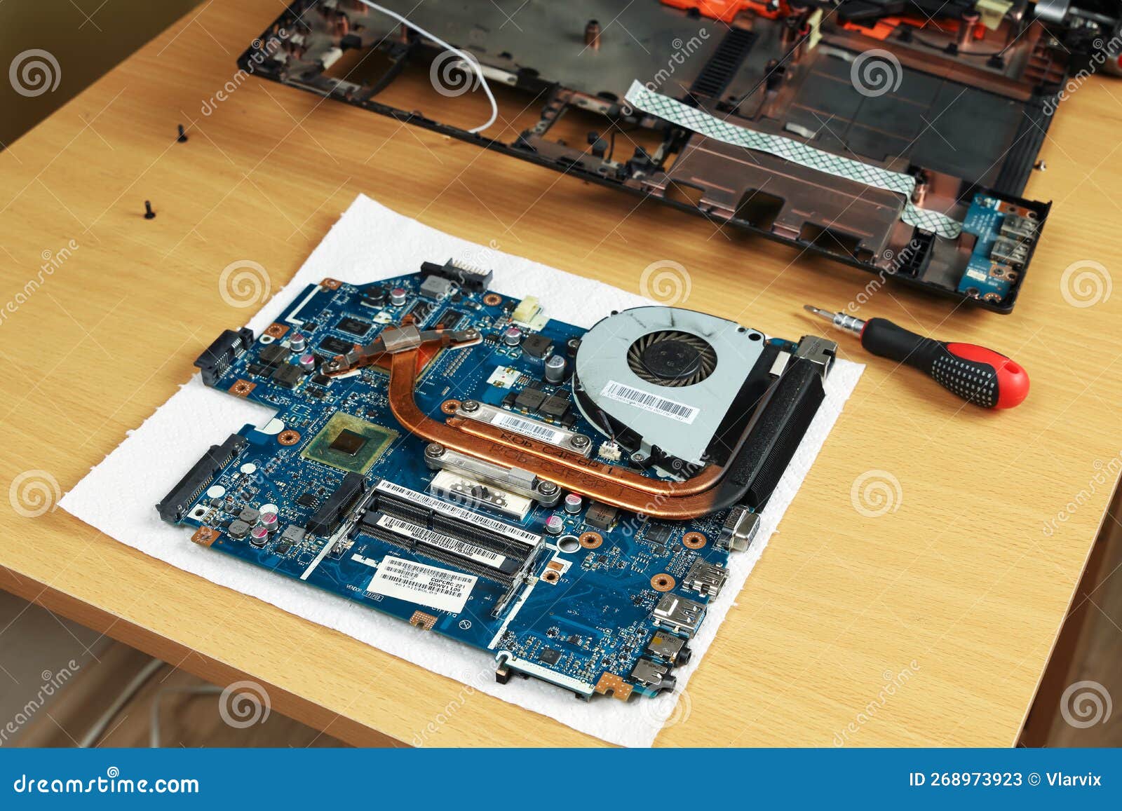 Laptop Repair, Motherboard with Processor Cooling System on Table