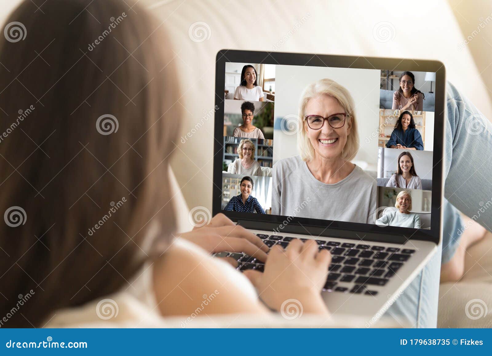 girl use laptop involved at group videocall with diverse women