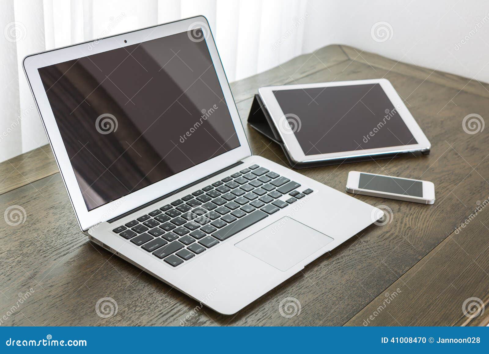 Laptop with Tablet and Smart Phone on Table Editorial Image Image of