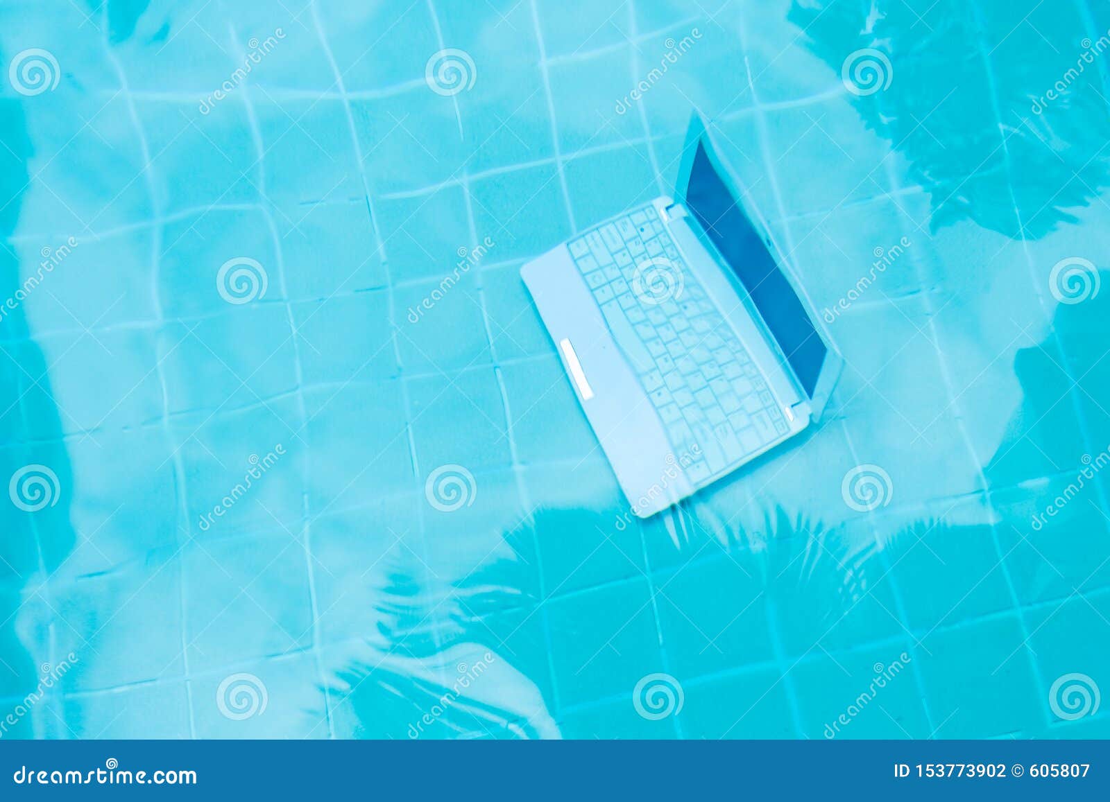 Laptop Under Water Minicomputer At The Bottom Of The Pool The
