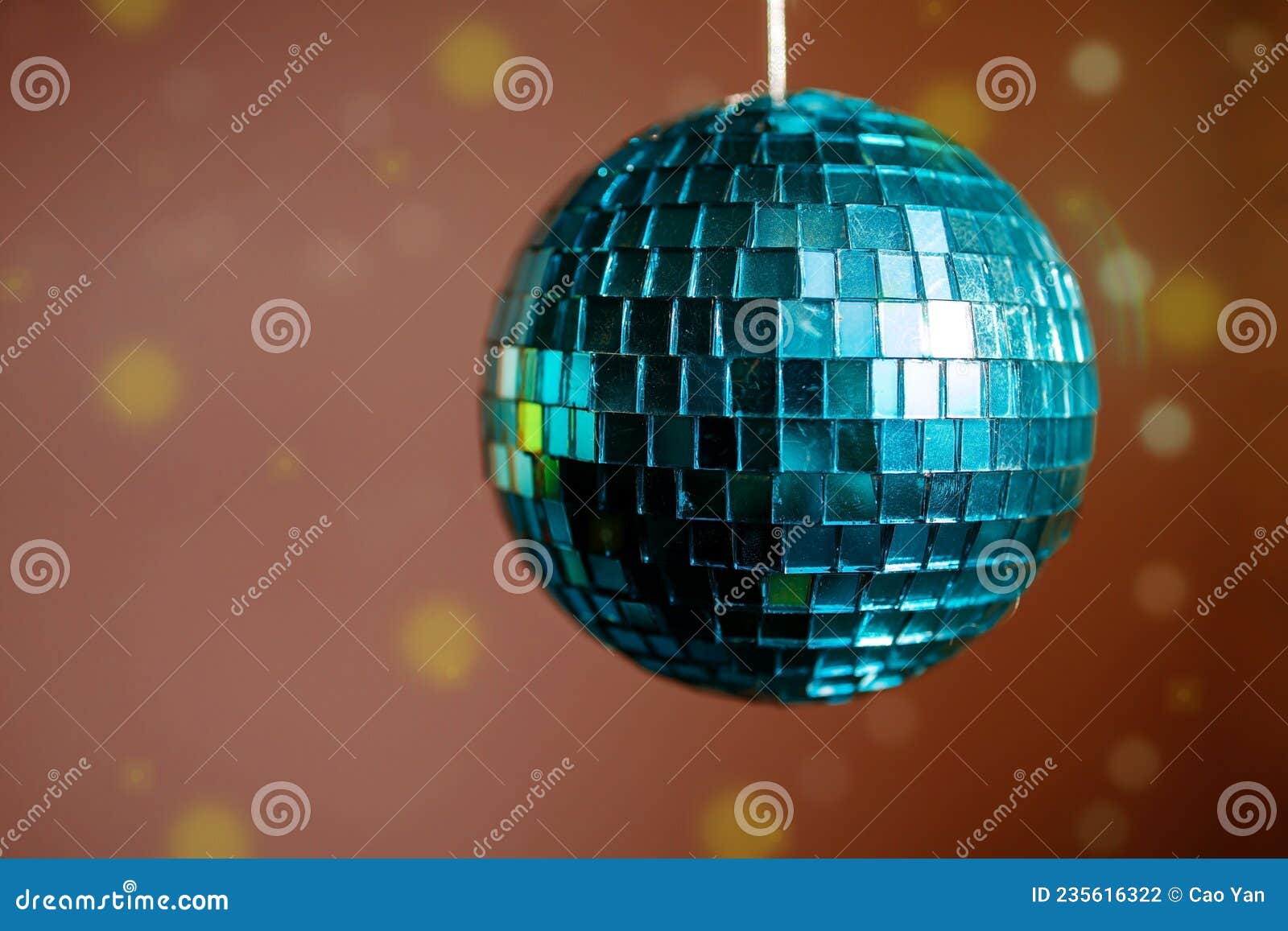 Large Blue Mirror Ball with Multicolored Reflections on a Dark