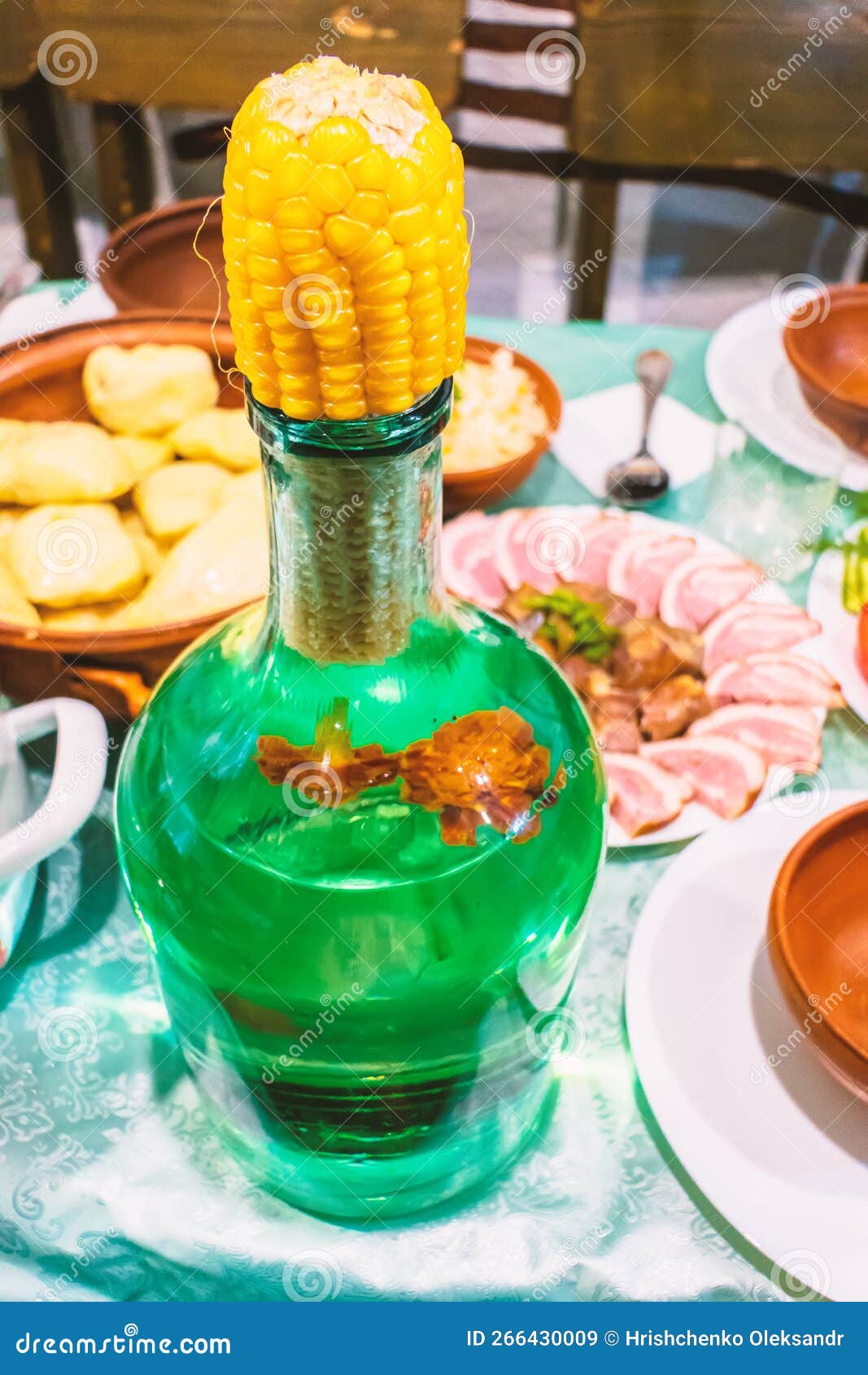 A Large Bottle of Vodka Covered with a Cob of Corn Stock Image Image