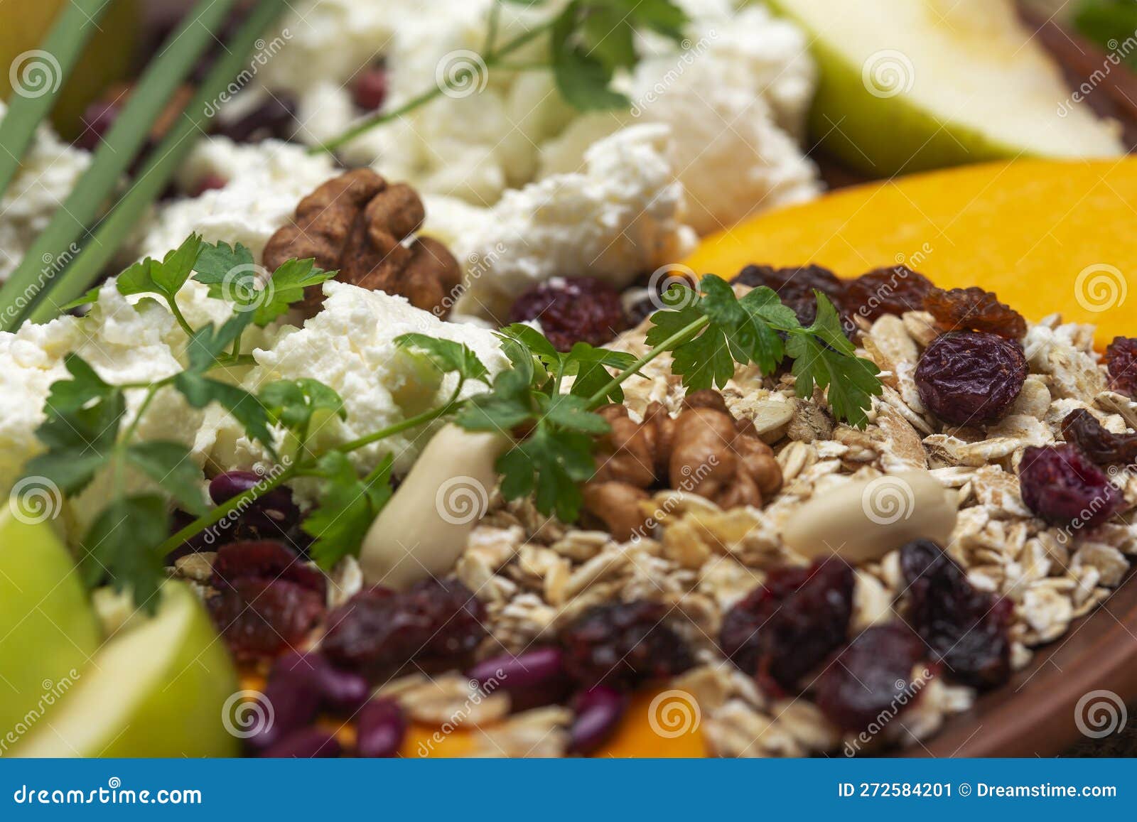 Large Bowl with Cottage Cheese, Nuts, Herbs and Dried Berries Stock