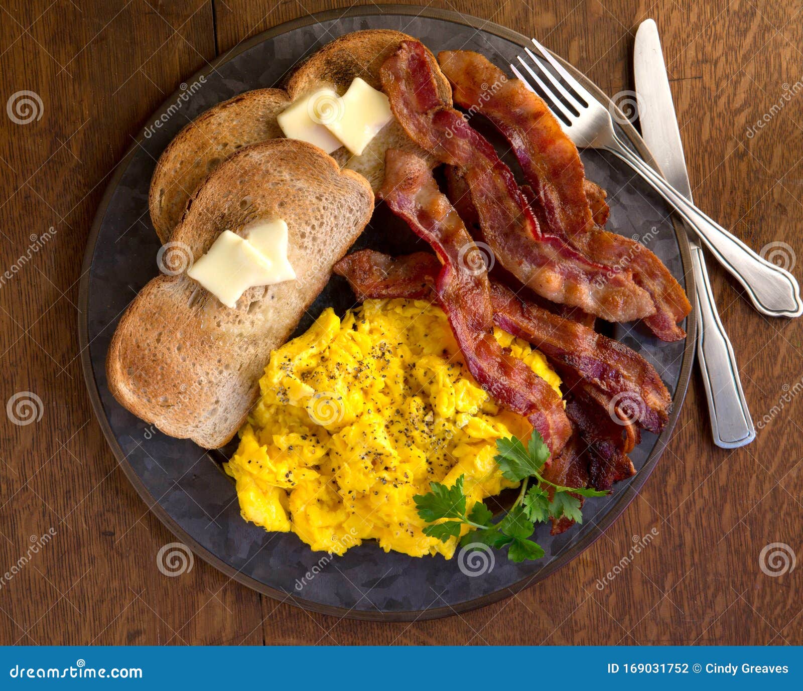 Srambled Eggs Bacon And Toast Plated On A Wood Table Stock Photo Image Of Breakfast Hearty