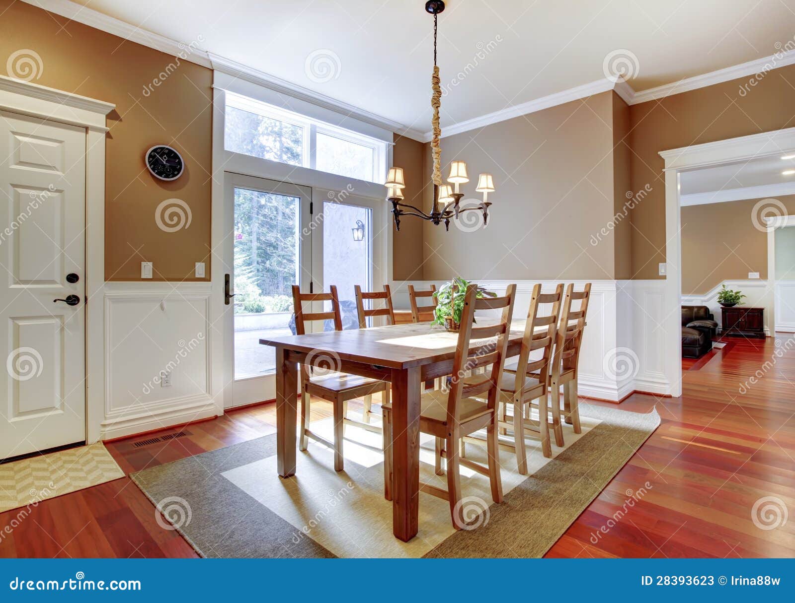 Large Bright Beige Dining Room with Cherry Hardwood. Stock Image