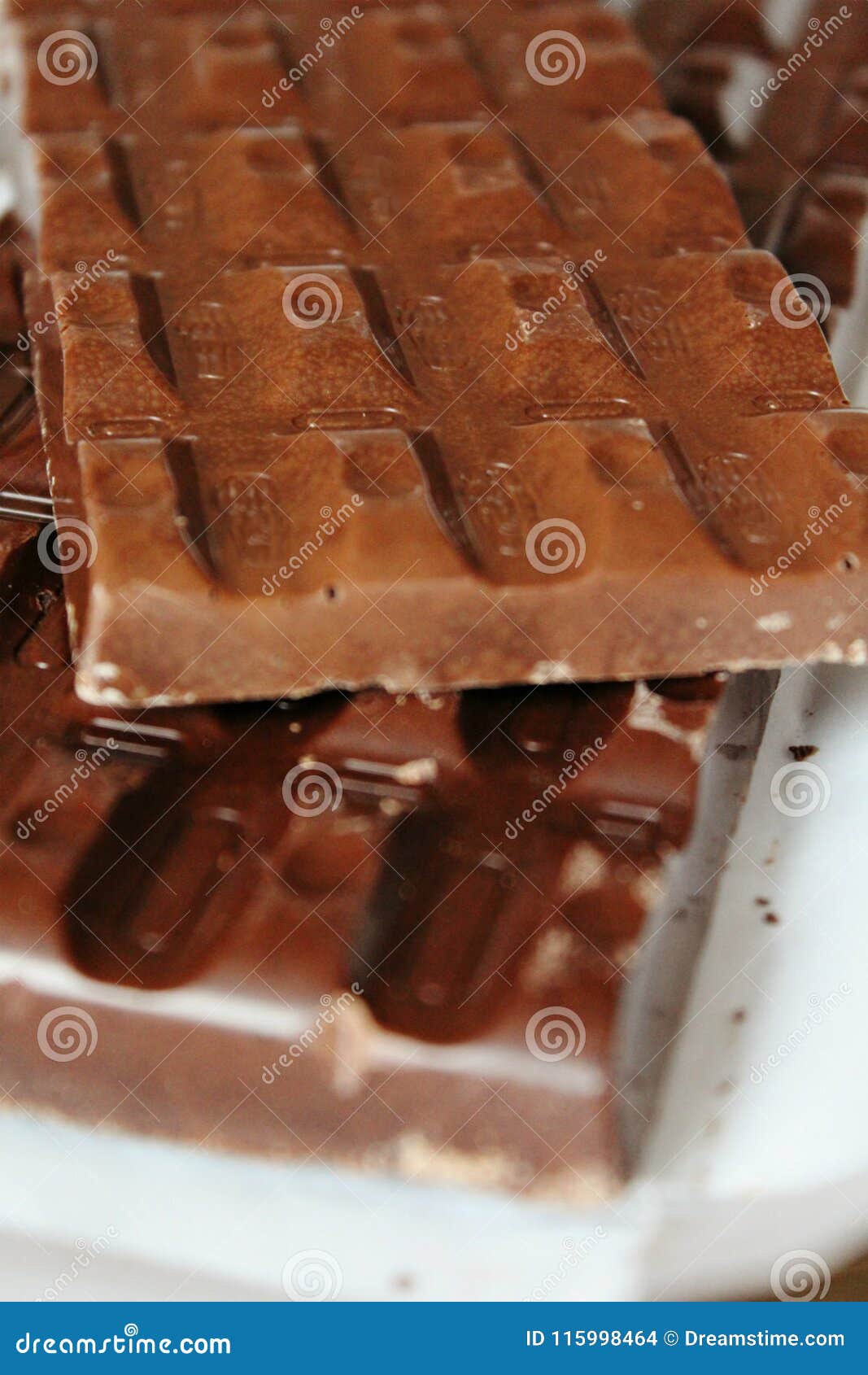 large brown chocolate bars of rectangular  close-up as a background.