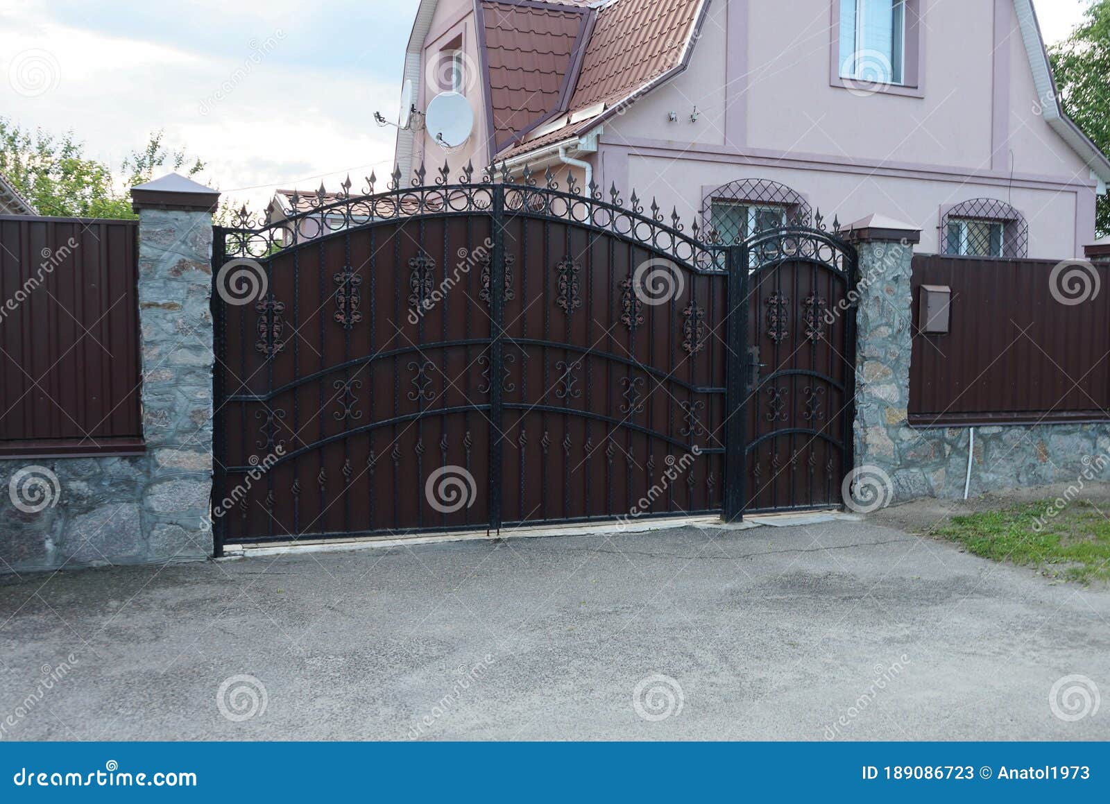 A Large Brown Iron Gate with a Black Pattern Stock Image Image