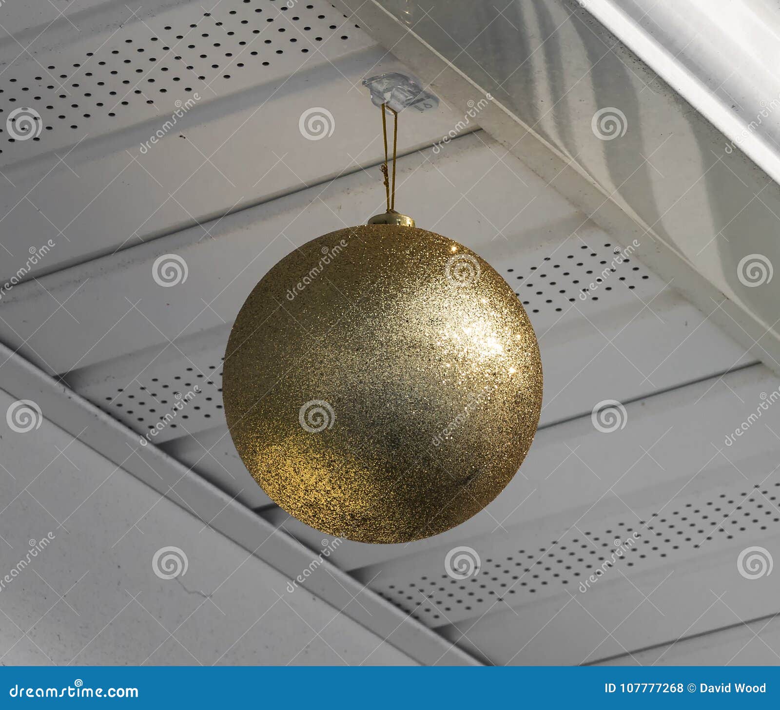 Large Christmas Ornament Hanging From A House Stock Photo