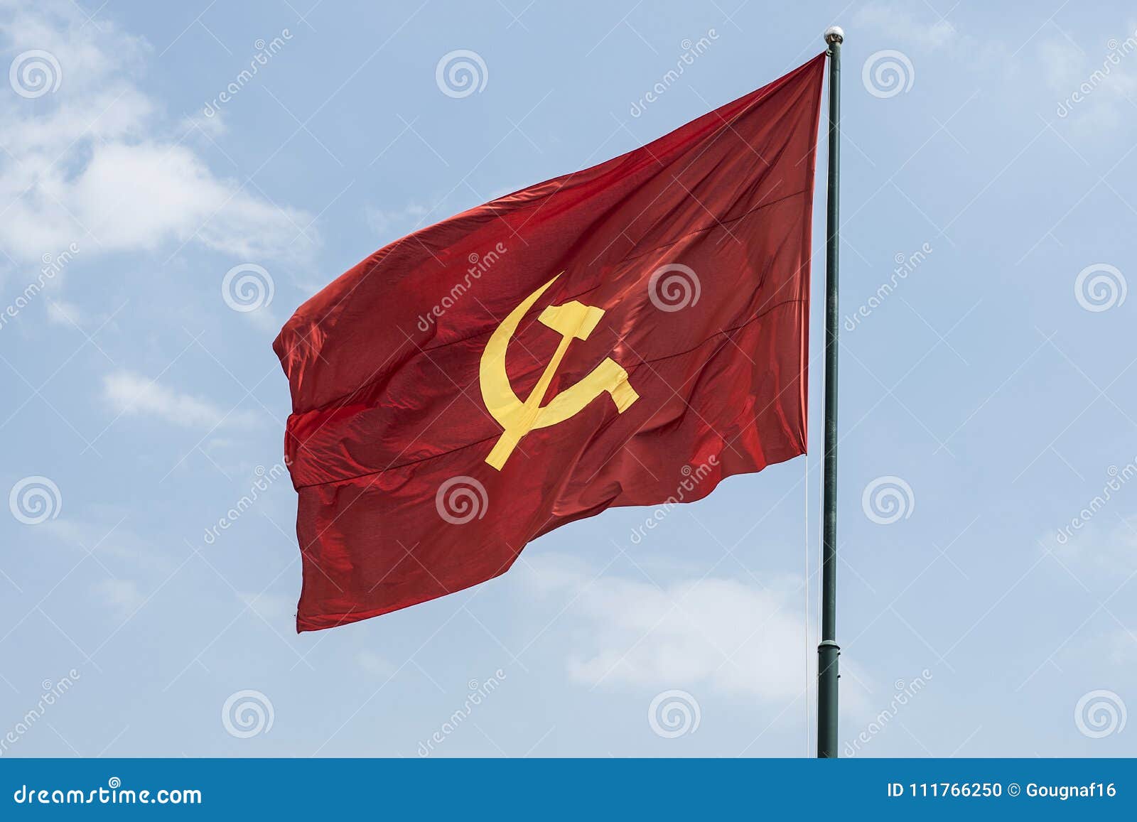 large communist flag floating in the wind