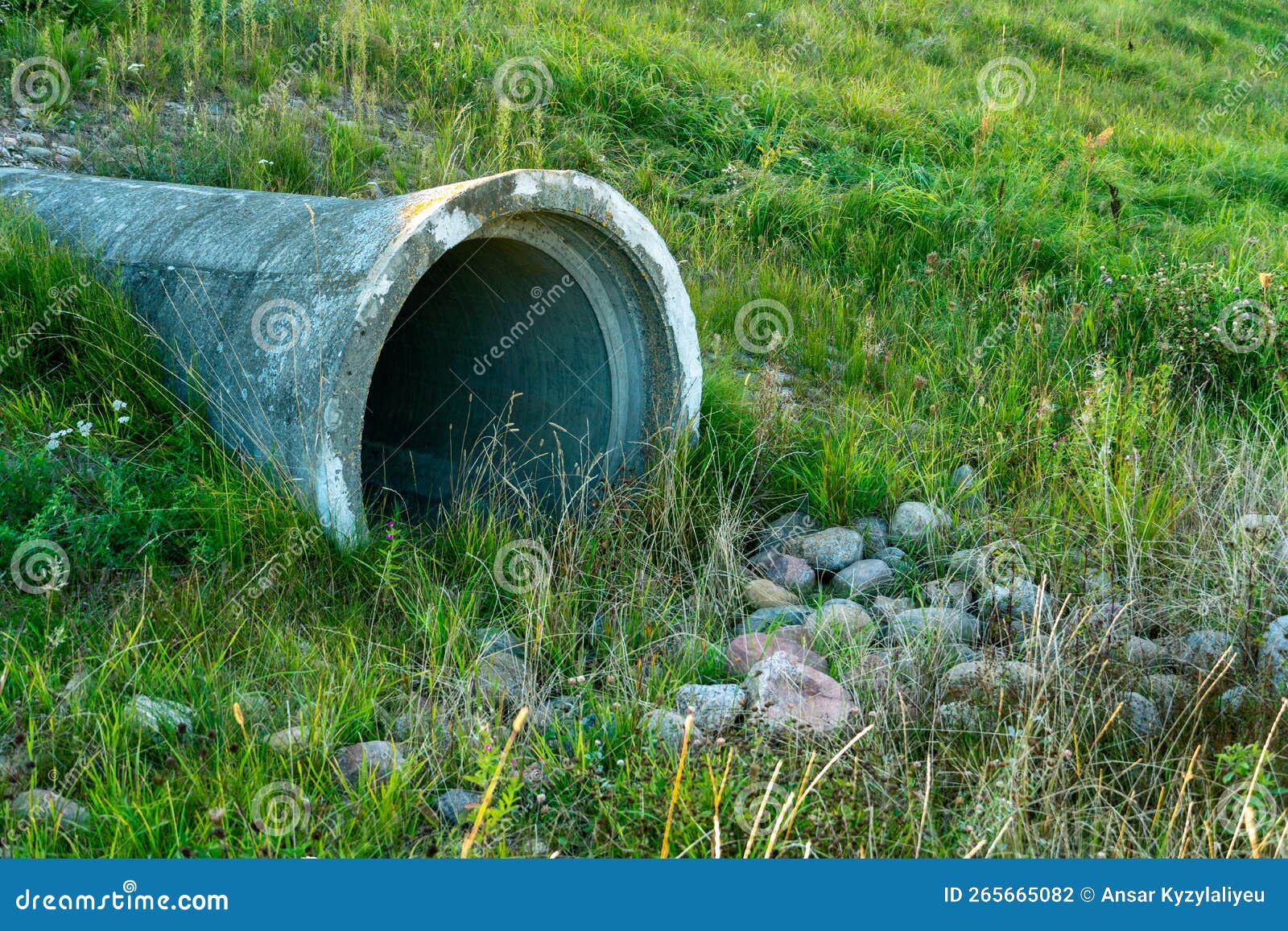 a large concrete pipe for diverting the river under the highway. leaky dirty water from large concrete pipes. dirty sewage from