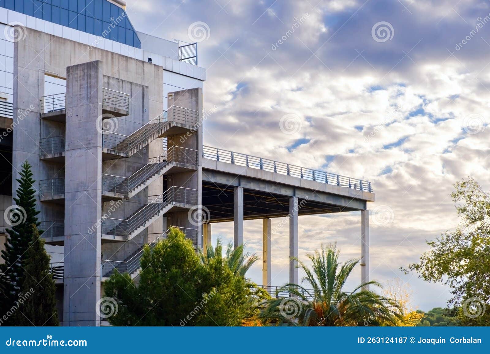 Large Concrete Public Building with a High Terrace at Sunset Stock