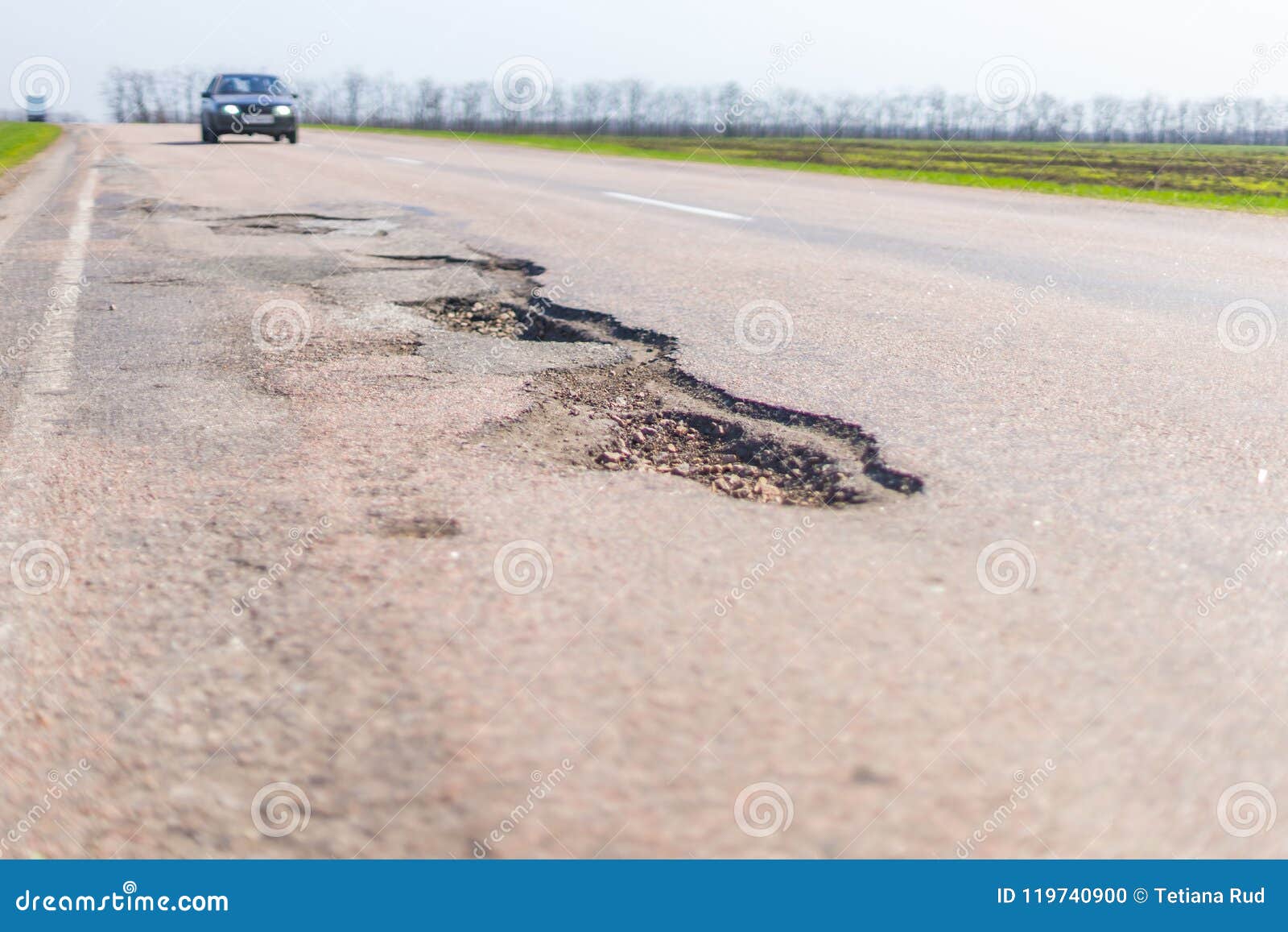large deep pothole an example of poor road