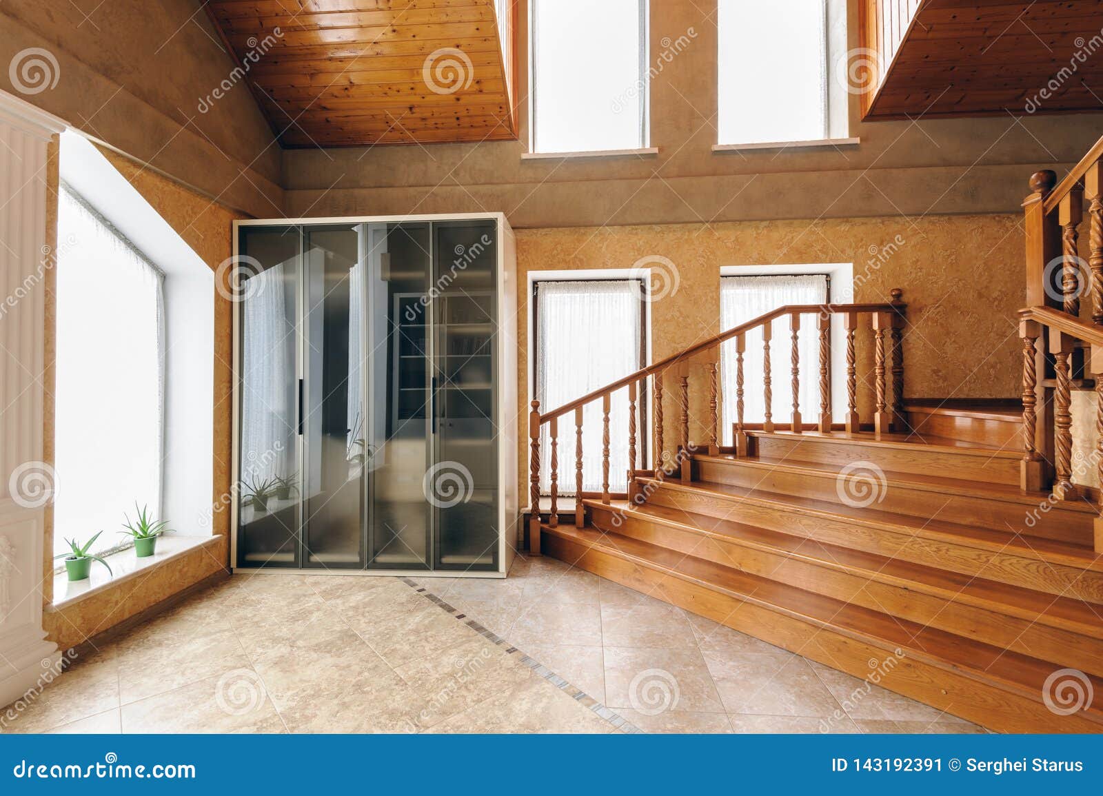 Large Entrance Hall Of A iModerni iHousei With Wooden Stairs 