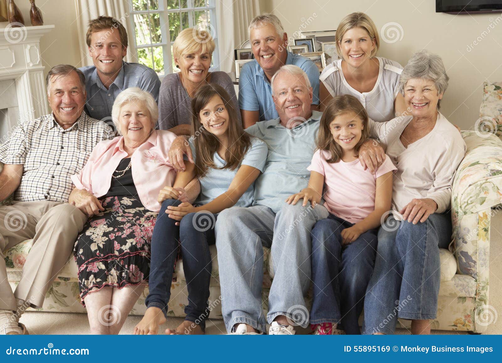 large family group sitting on sofa indoors