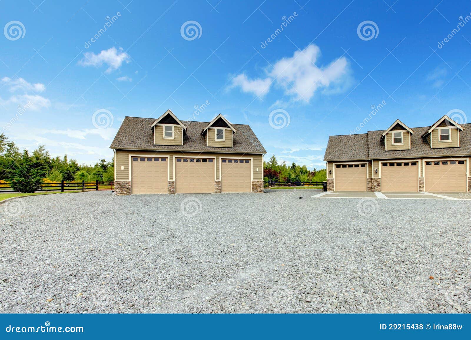 large farm country house with gravel driveway and green landscape.