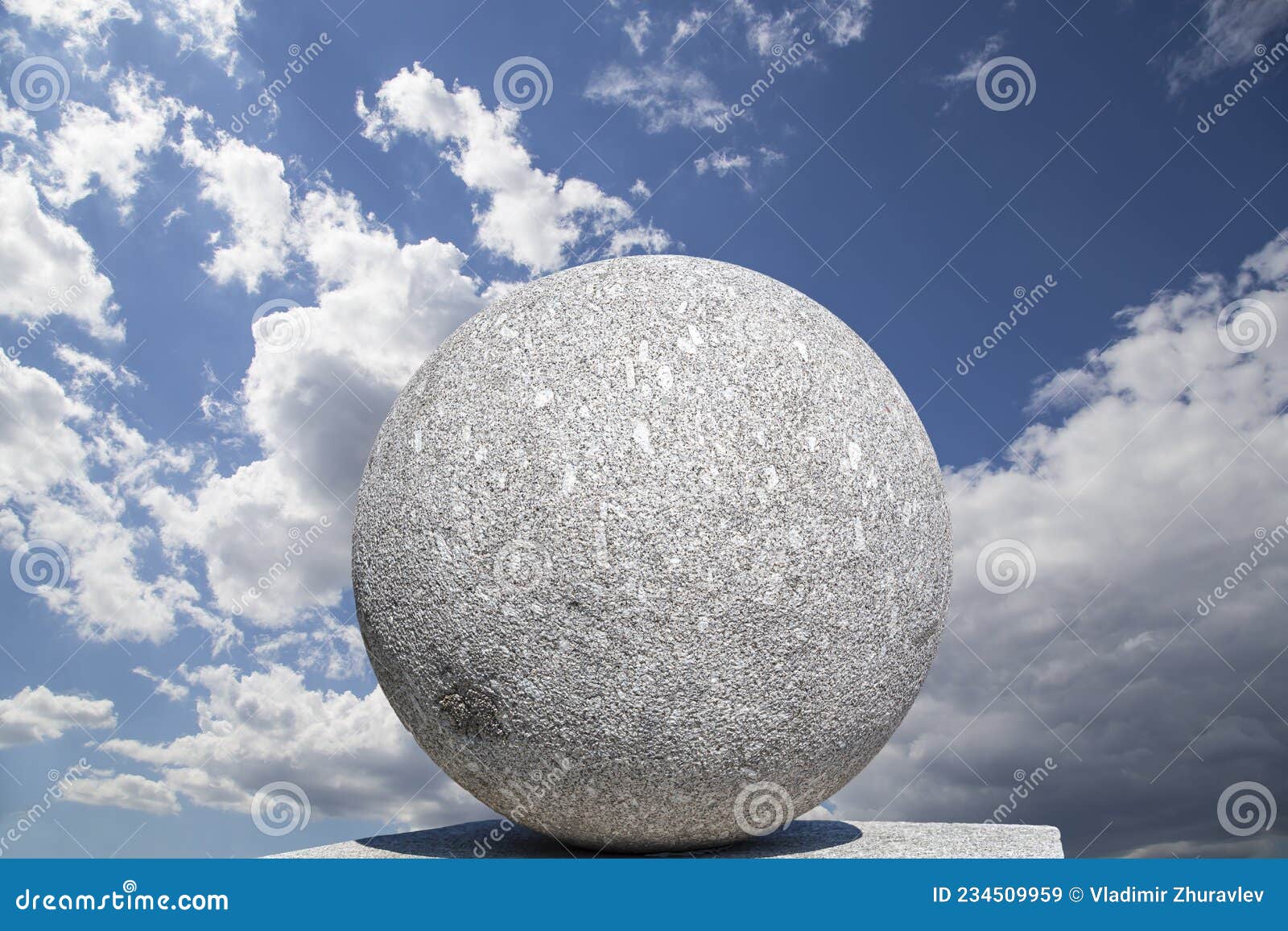 Large Granite Ball on the Background of the Sky with Clouds Stock Image ...