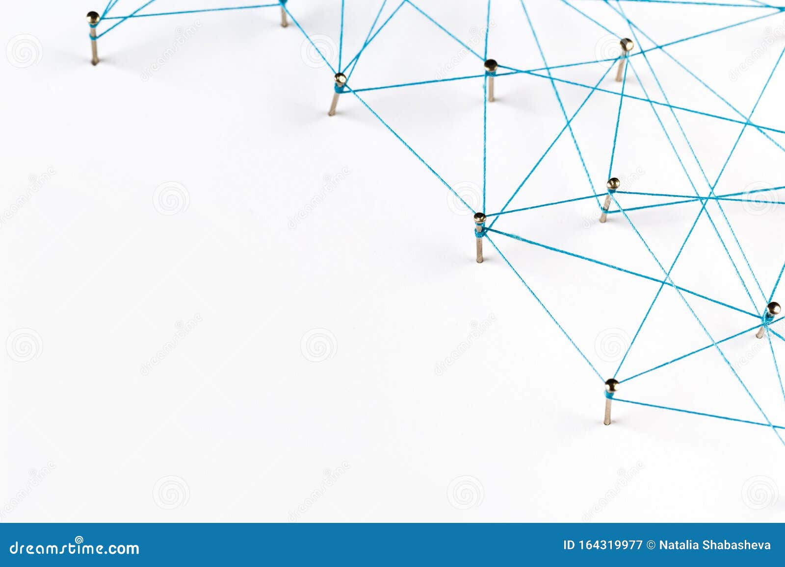 A Large Grid of Pins Connected with String. Communication, Technology