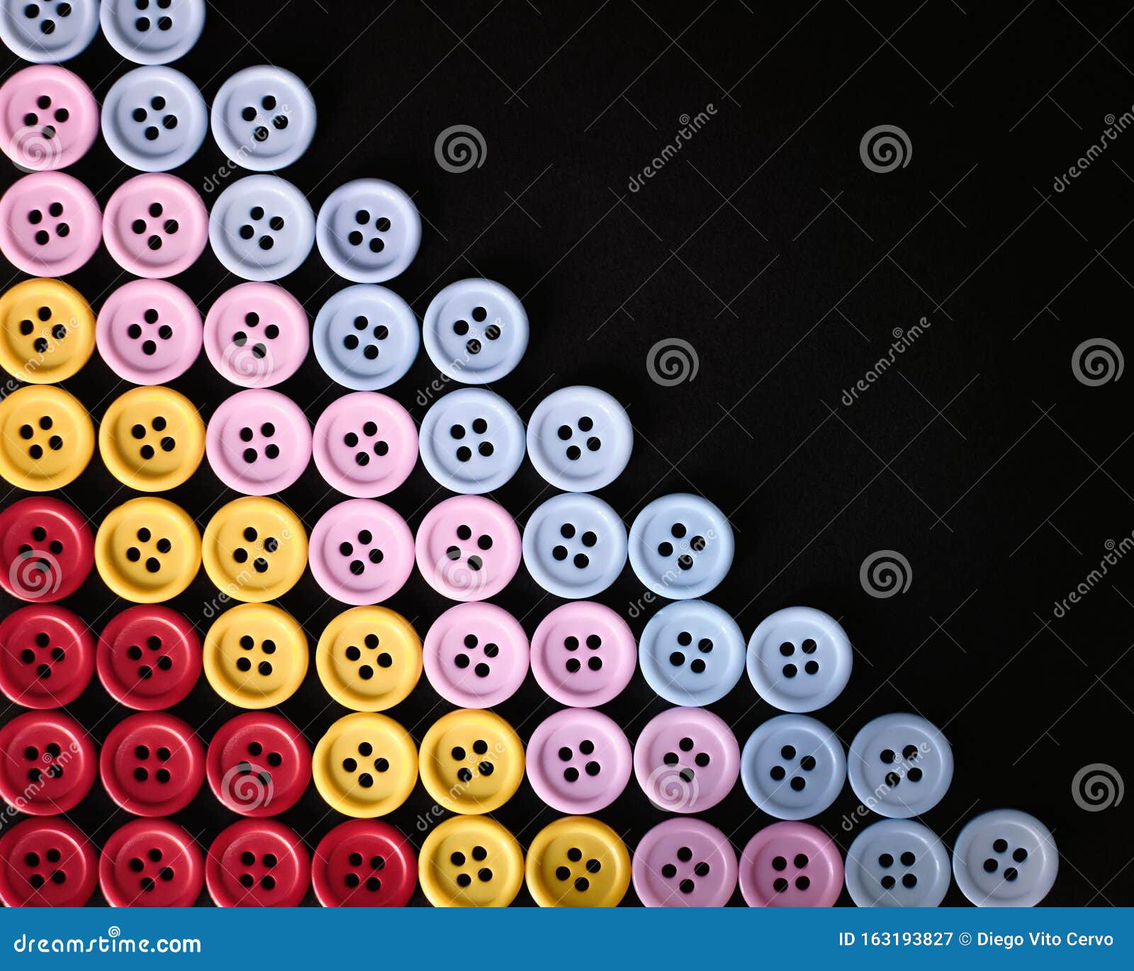 Large Group of Colorful Plastic Sewing Buttons on Black Background