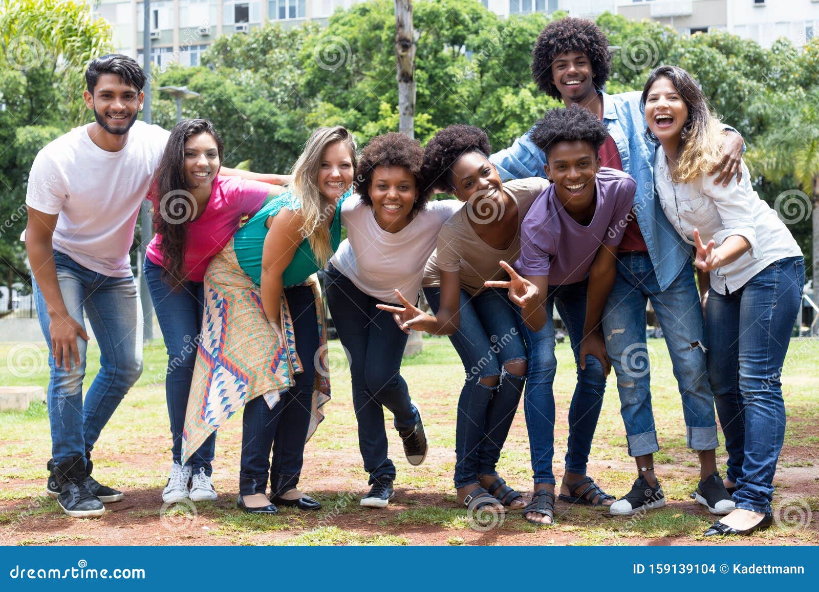 large group of happy laughing international young adults