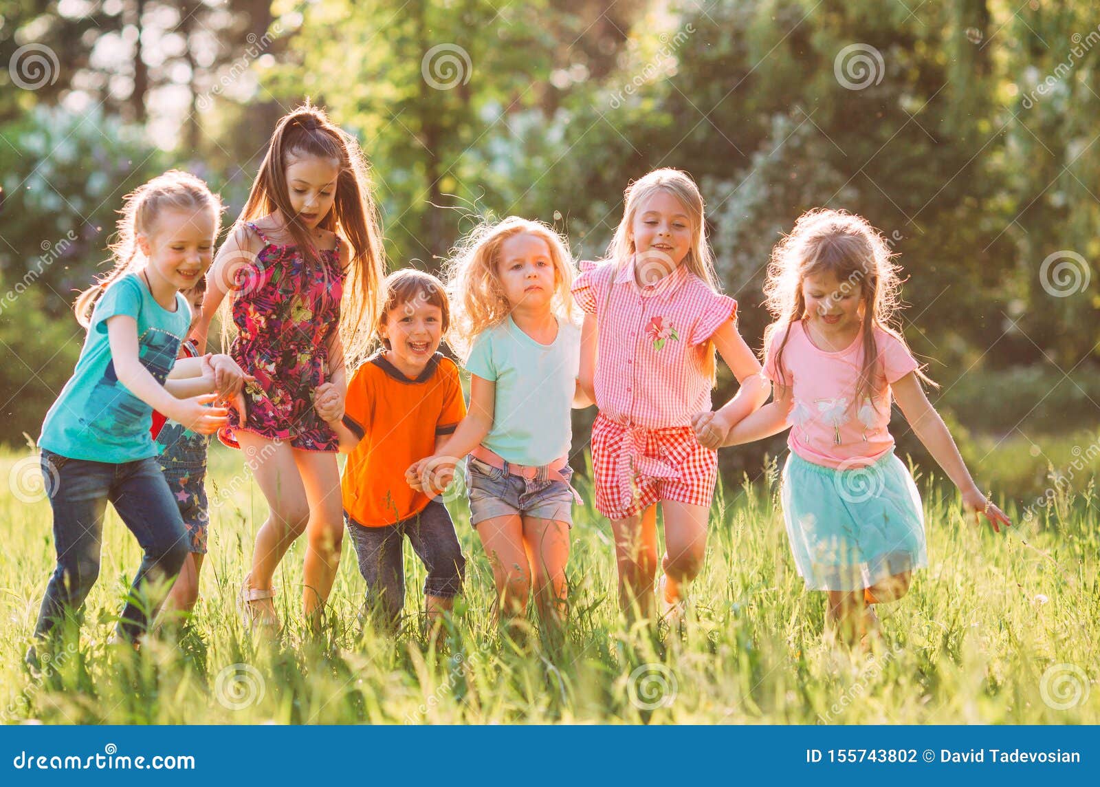 Large Group of Kids, Friends Boys and Girls Running in the Park on Sunny  Summer Day in Casual Clothes . Stock Photo - Image of casual, group:  155743802