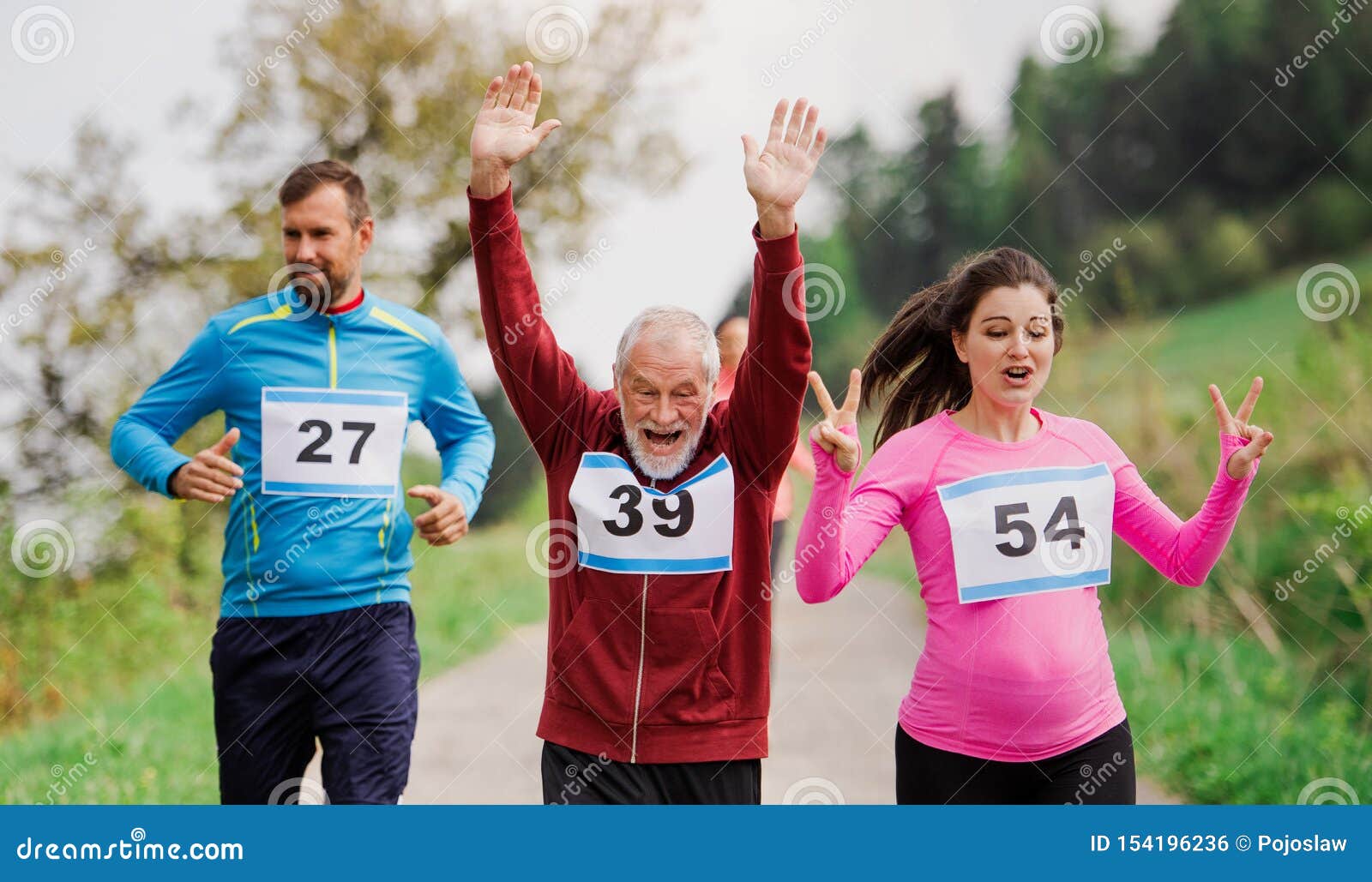 Large Group of Multi Generation People Running a Race Competition in