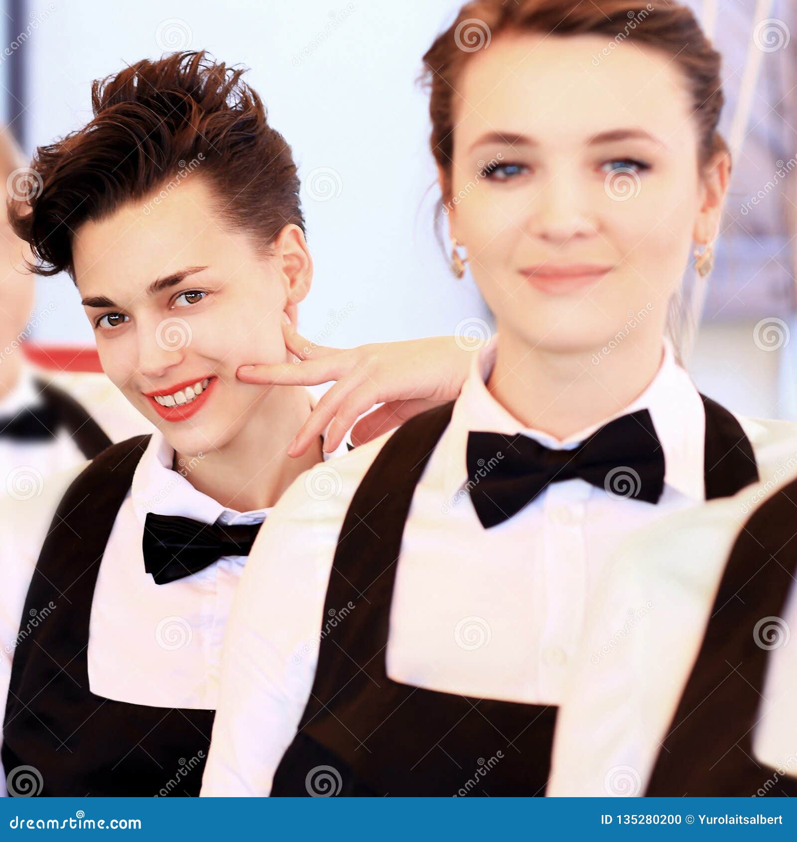 Large Group of Waiters and Waitresses Standing in Row. Stock Photo