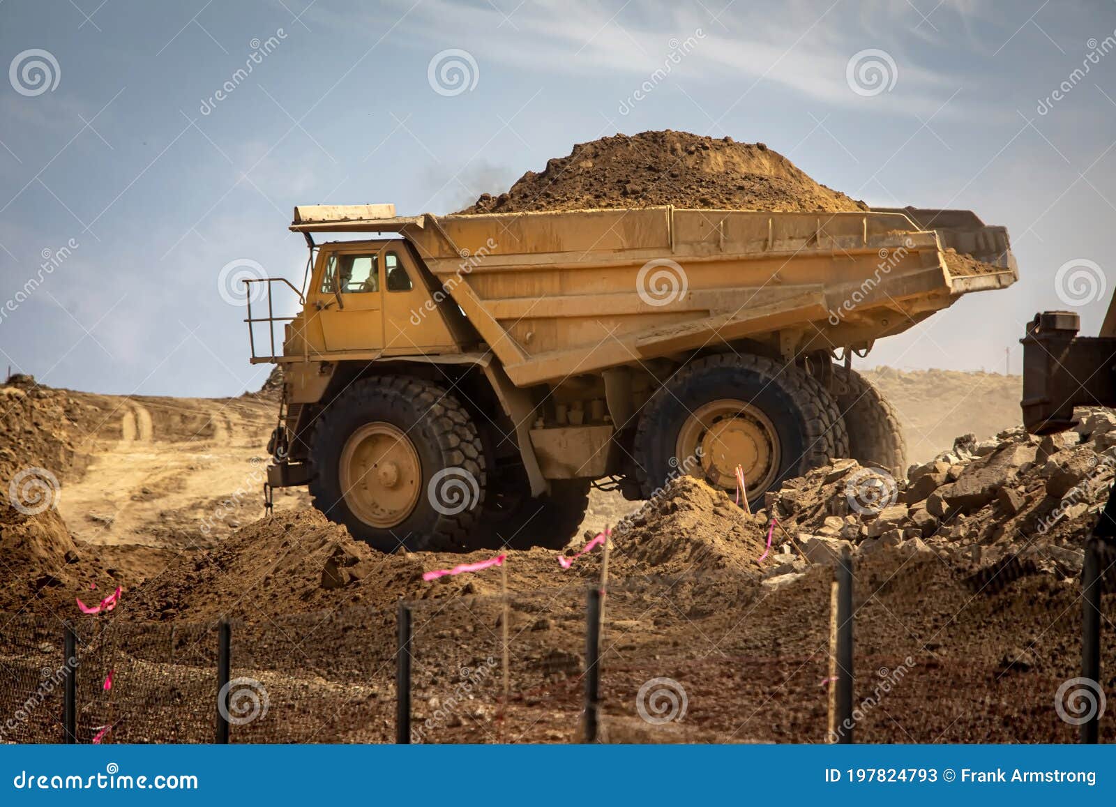 Large Haul Dump Truck at a Construction Site Filled with Dirt Stock