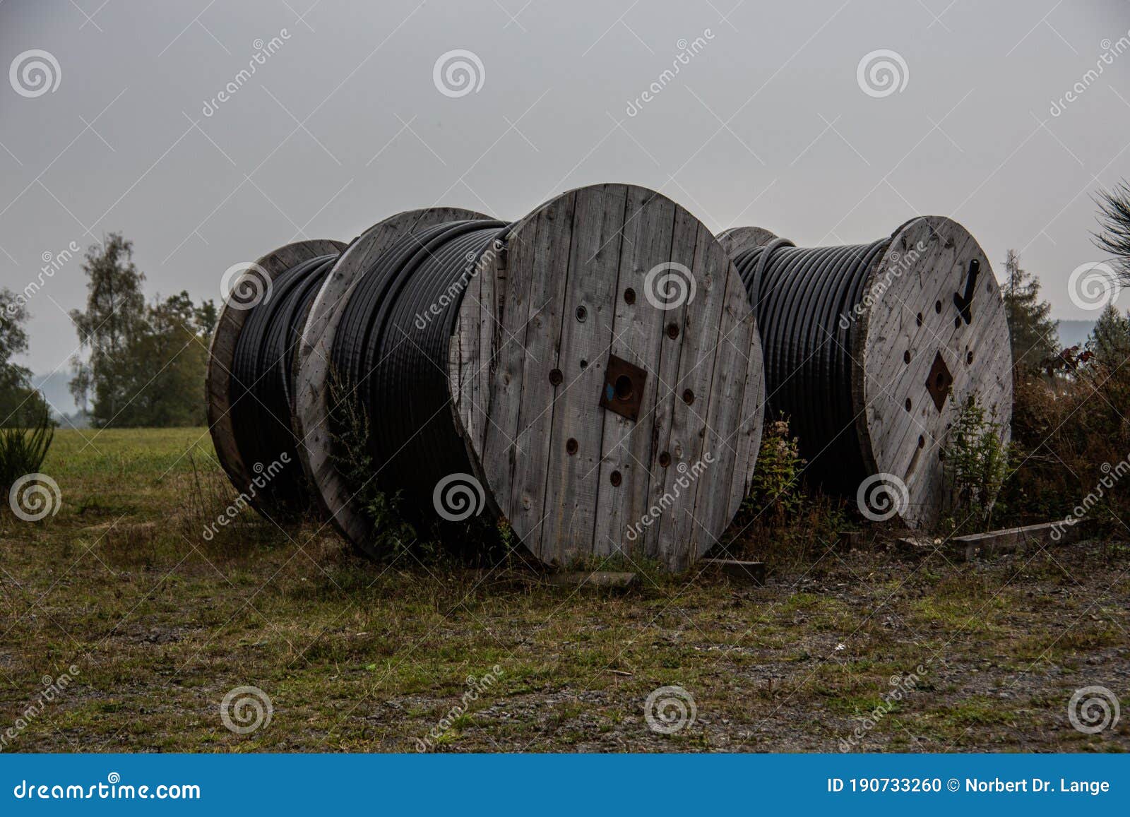 Large Heavy Cable Drums with Insulated Copper Cables Stock Photo