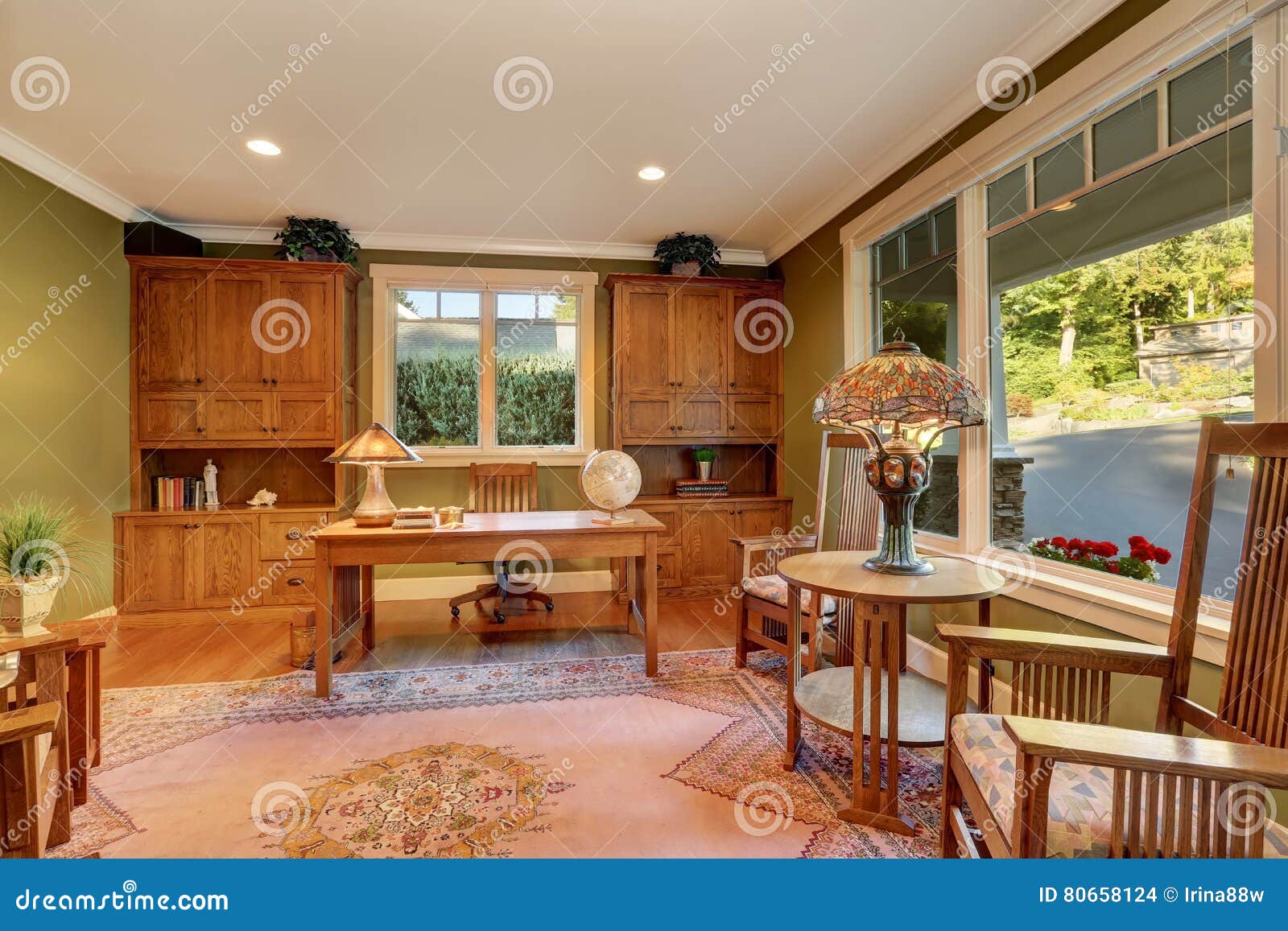 Large Home Office Interior With Green Olive Walls Stock Photo