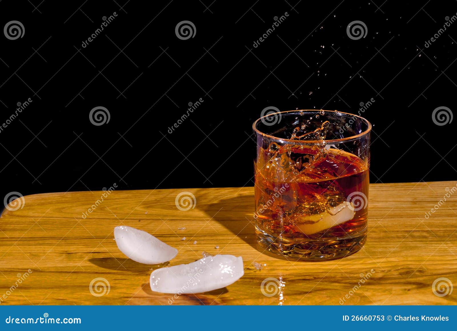Large Ice Bropped into a Glass of Bourbon Stock Image Image of luxury, brandy 26660753