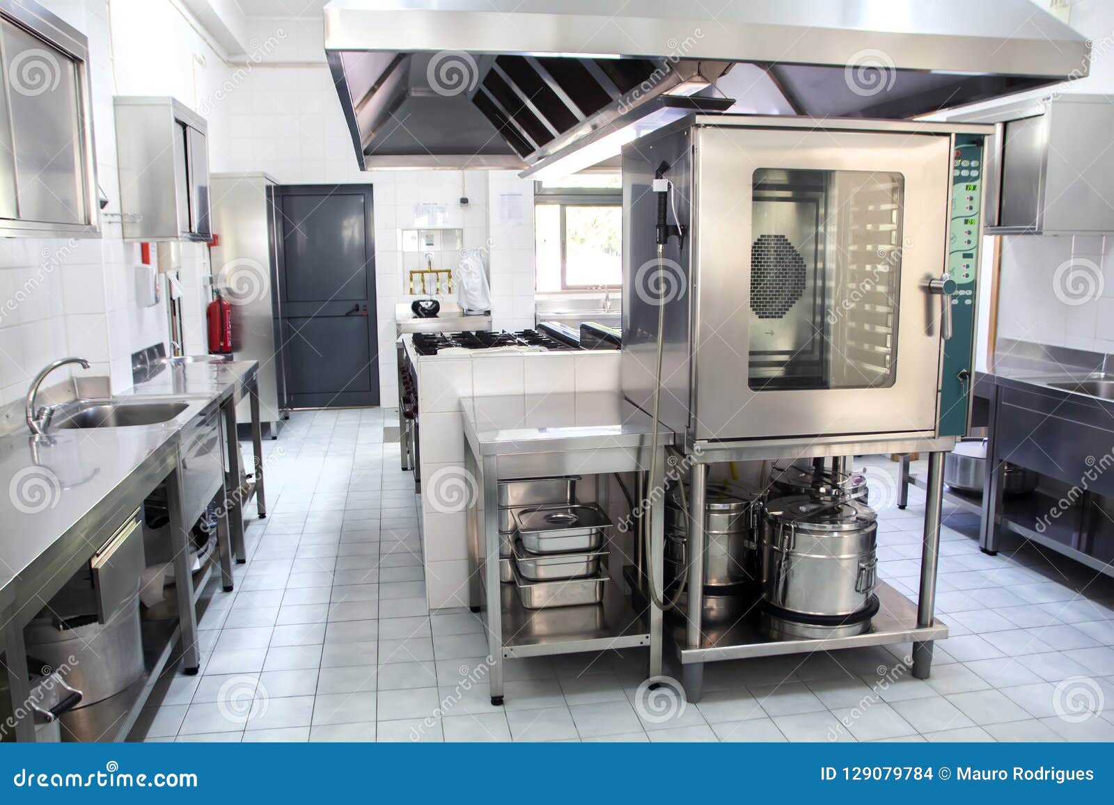 Large industrial kitchen stock photo. Image of tidy 129079784